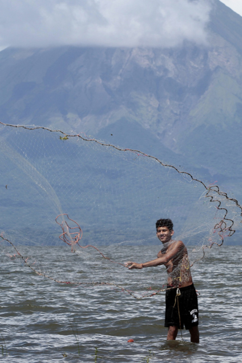 <p>A fisherman casts a fishing net at Lake Cocibolca in Rivas, Nicaragua.</p>
