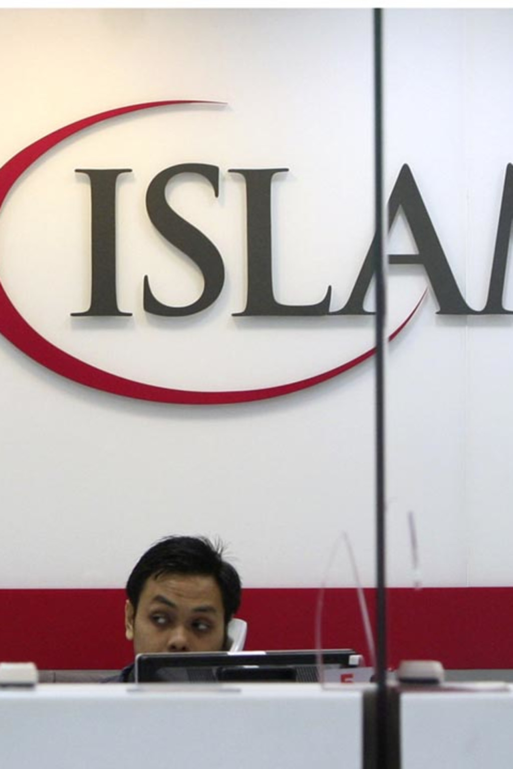 <p>A staffer at the Bank Islam branch office near Kuala Lumpur, Malaysia.</p>

