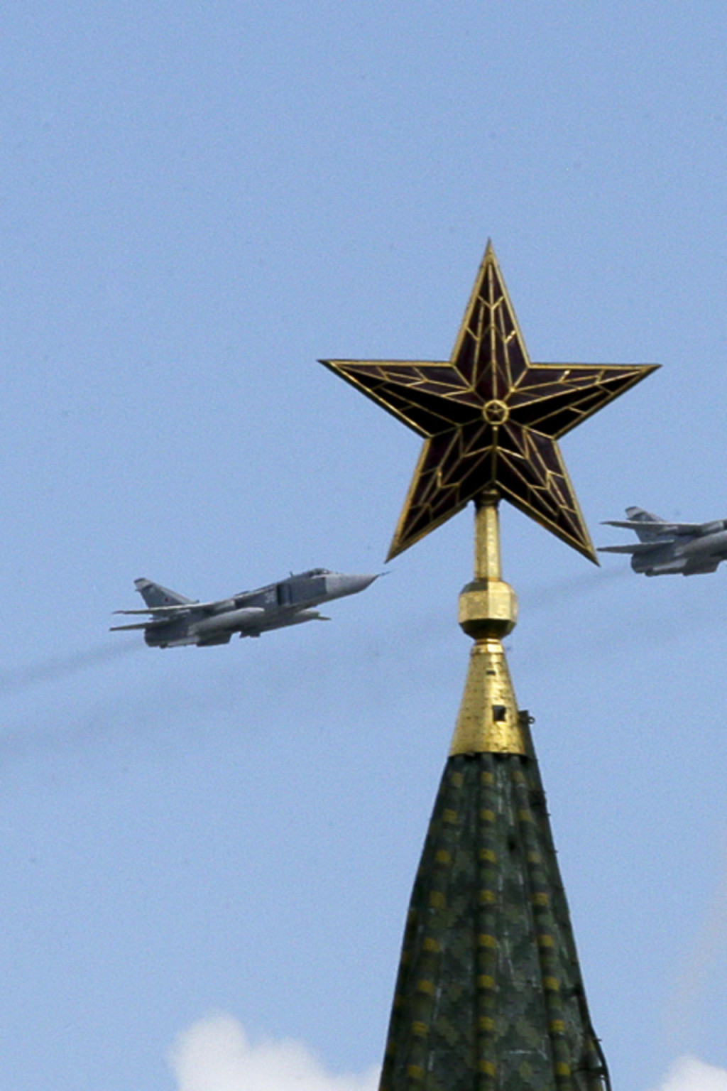 <p>Russian jets fly in formation during rehearsals for the Victory Day military parade, with a tower of the Kremlin seen in the foreground, May 3, 2014.</p>