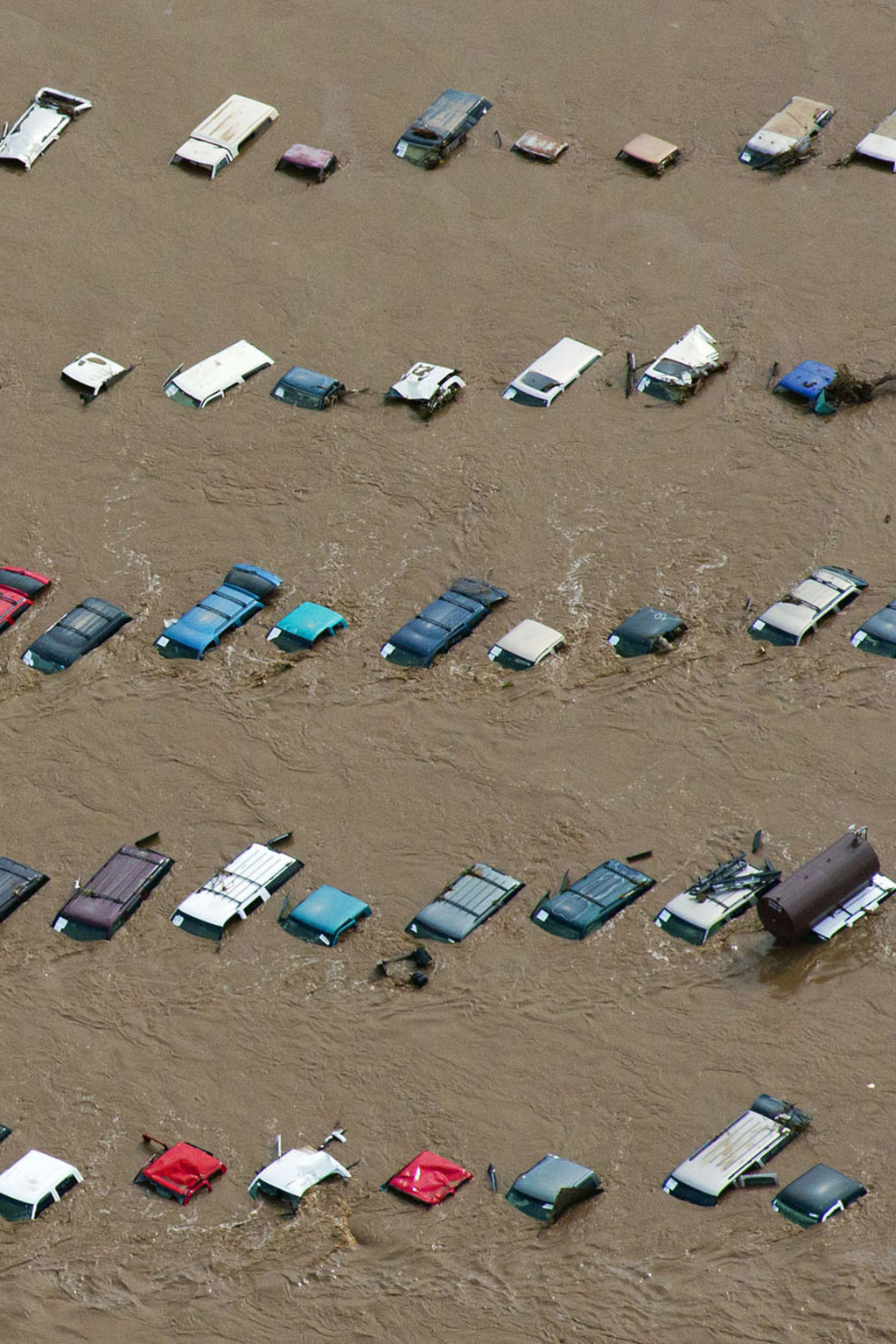 An aerial view of vehicles submerged in flood waters along the Sough Platte River near Greenley