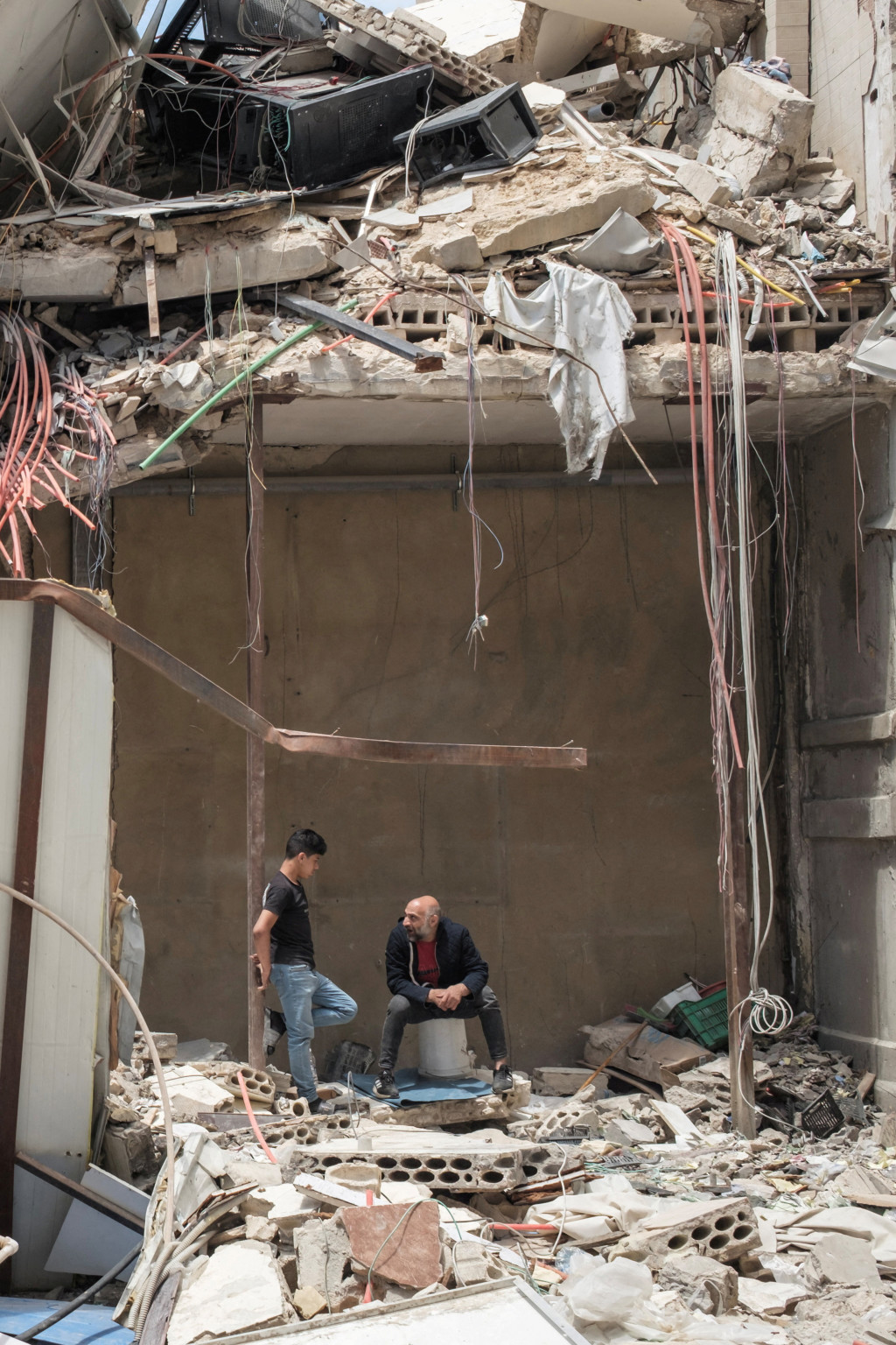 <p>People inside a destroyed building, amid a temporary ceasefire between Lebanon and Israel, in Tyre, southern Lebanon, April 28, 2026.</p>
