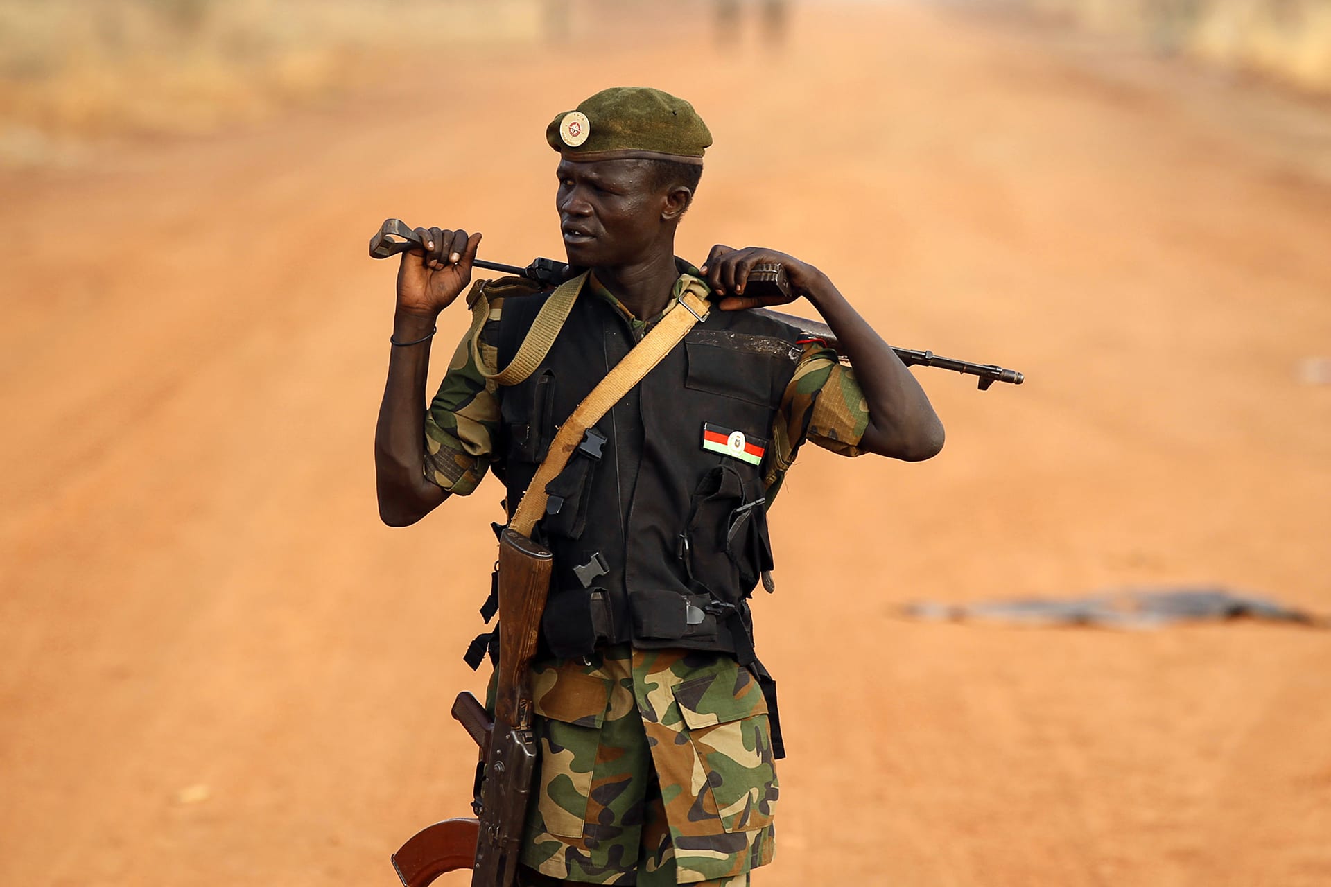 A South Sudan's army, or the SPLA, soldier walks on the frontline in Panakuach