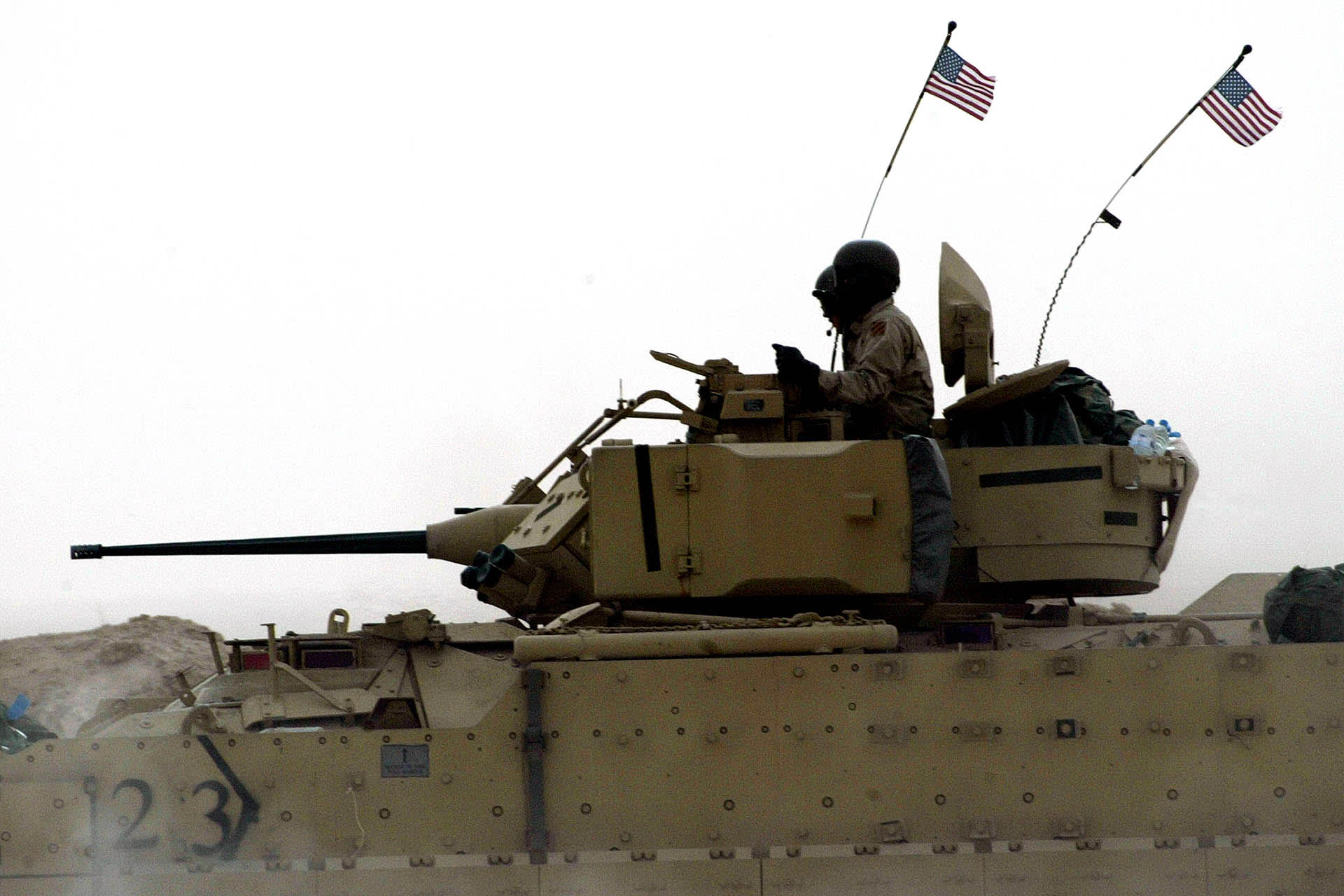 U.S. ARMOUR ROLLS ACROSS KUWAITI DESERT NEAR BORDER WITH IRAQ.