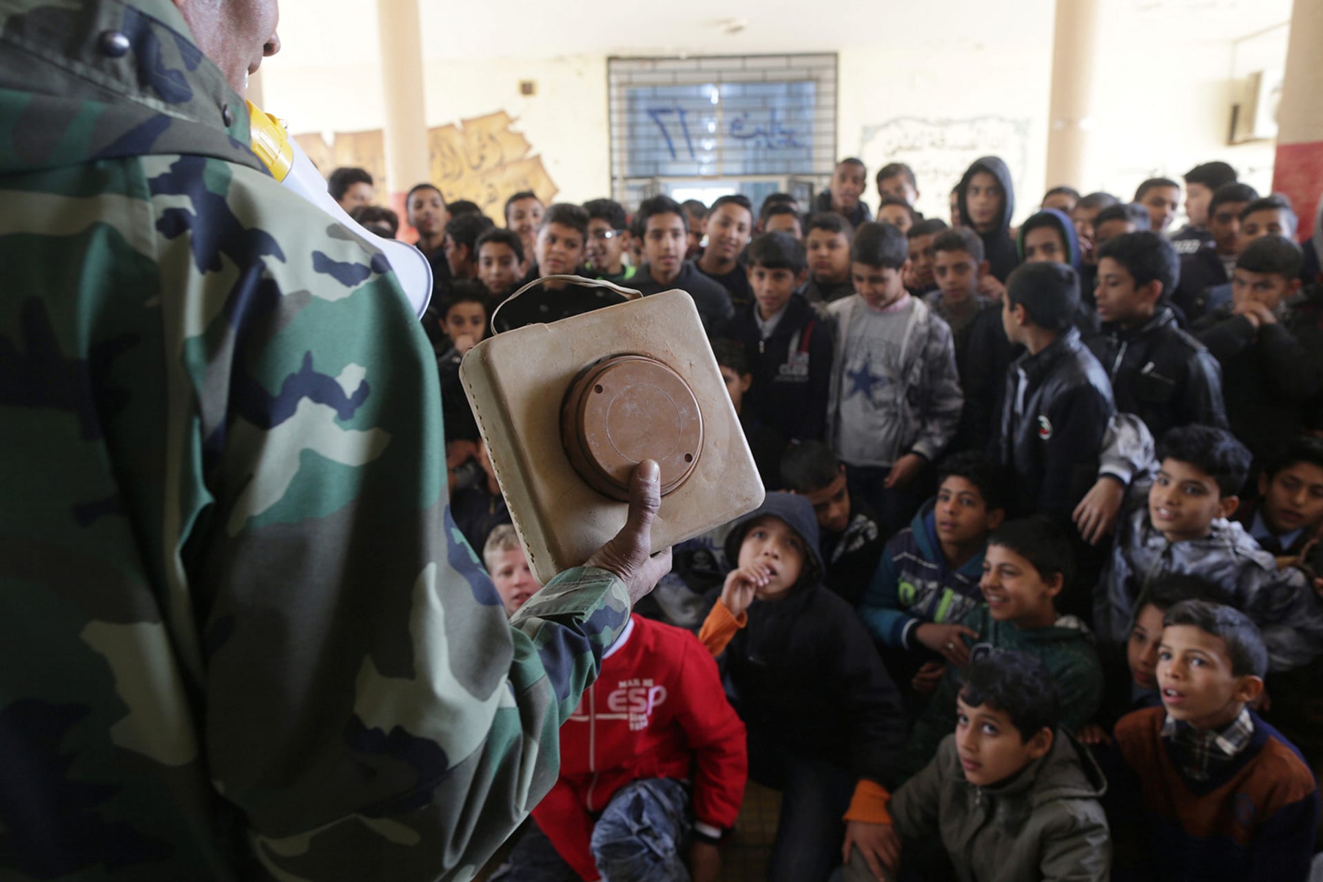 A member of the self-styled Libyan National Army gives a class aimed at raising awareness about mines and explosives to schoolboys in Benghazi, Libya on March 12, 2017