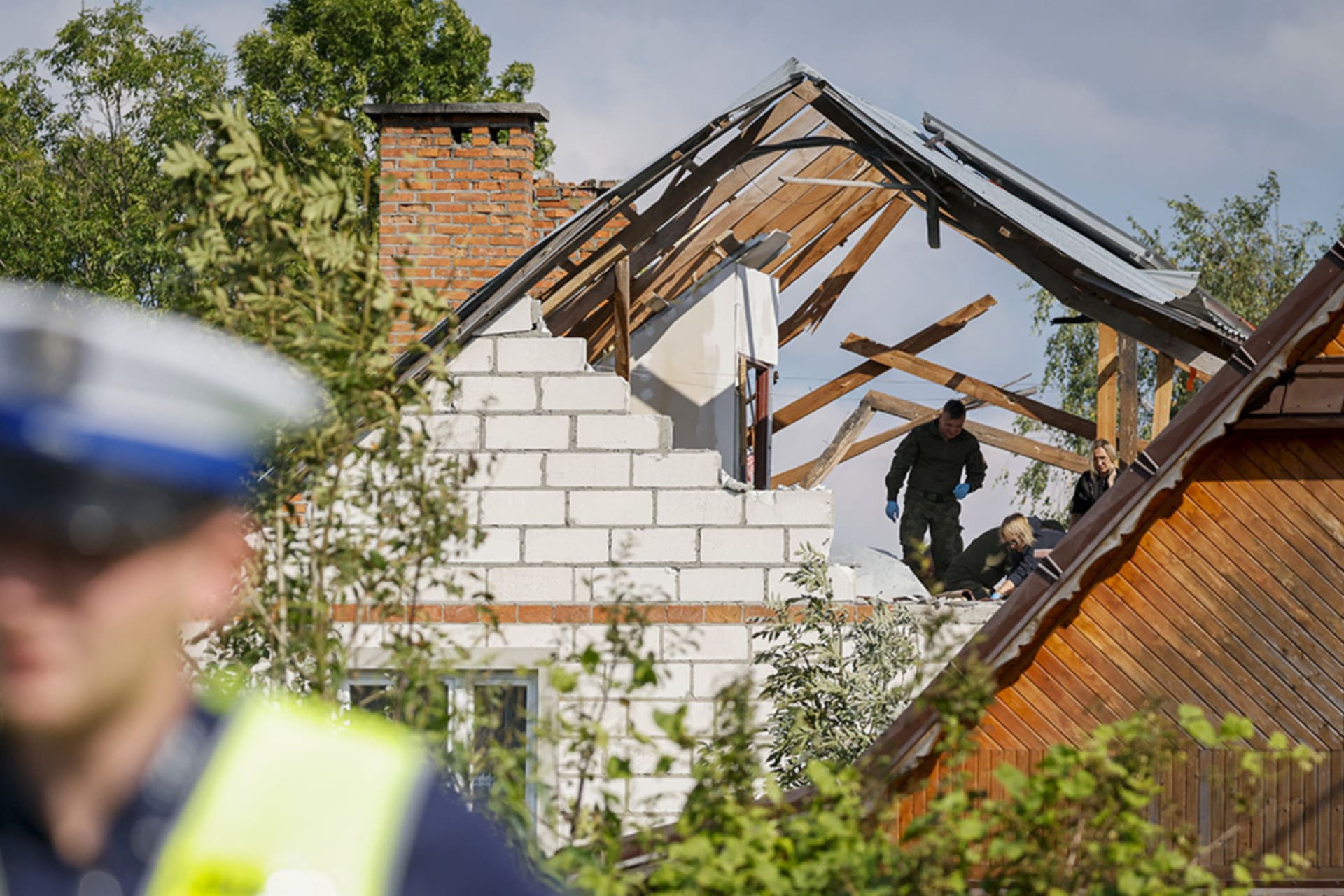 <p>Members of the police and the army inspect damage to a house destroyed by debris from a Russian drone in the village of Wyryki-Wola,  Poland, September 10, 2025.</p>
