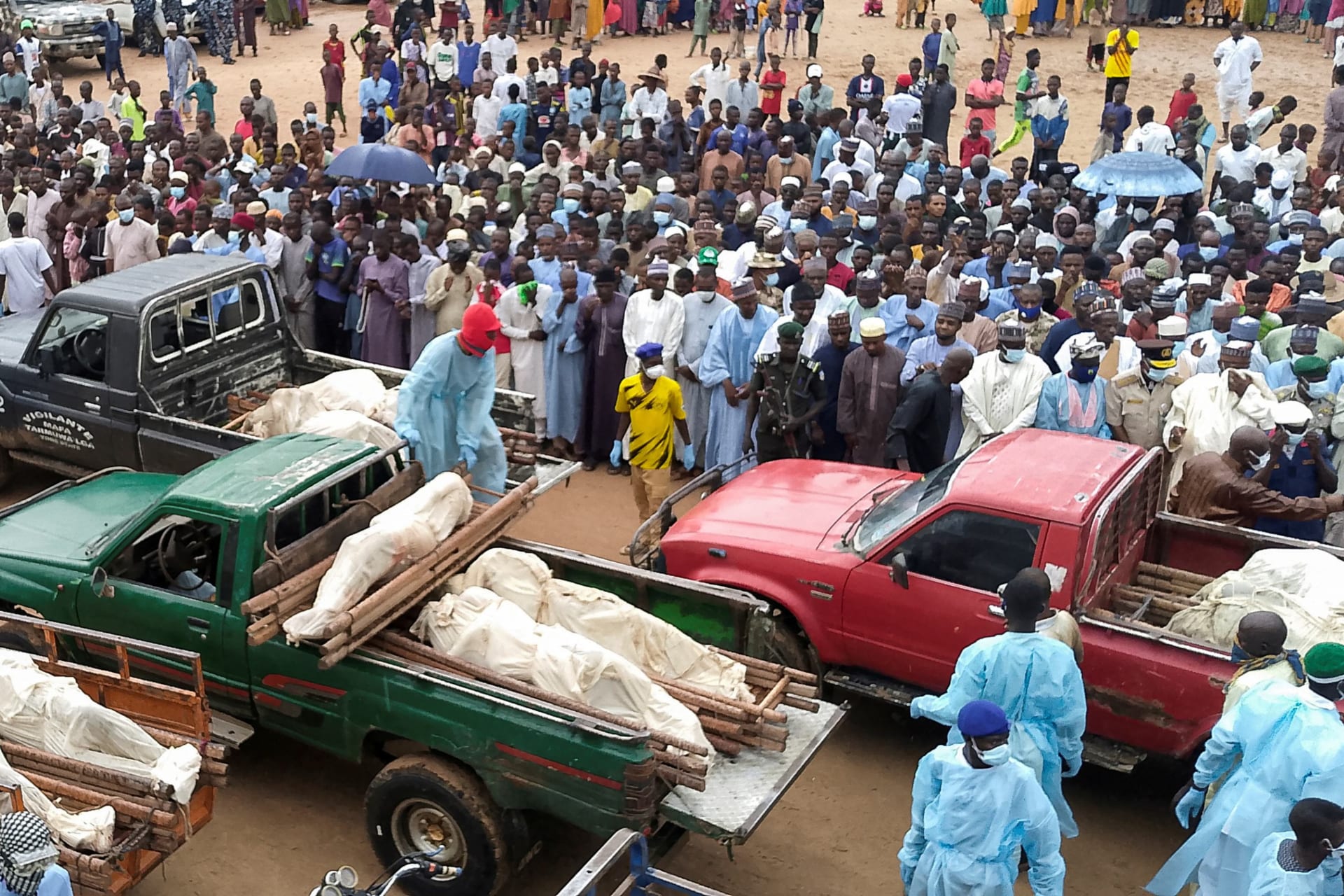 <p>Trucks carry the wrapped bodies of people killed by suspected Boko Haram militants, during their funeral in Yobe, Nigeria, on September 3, 2024.</p>

