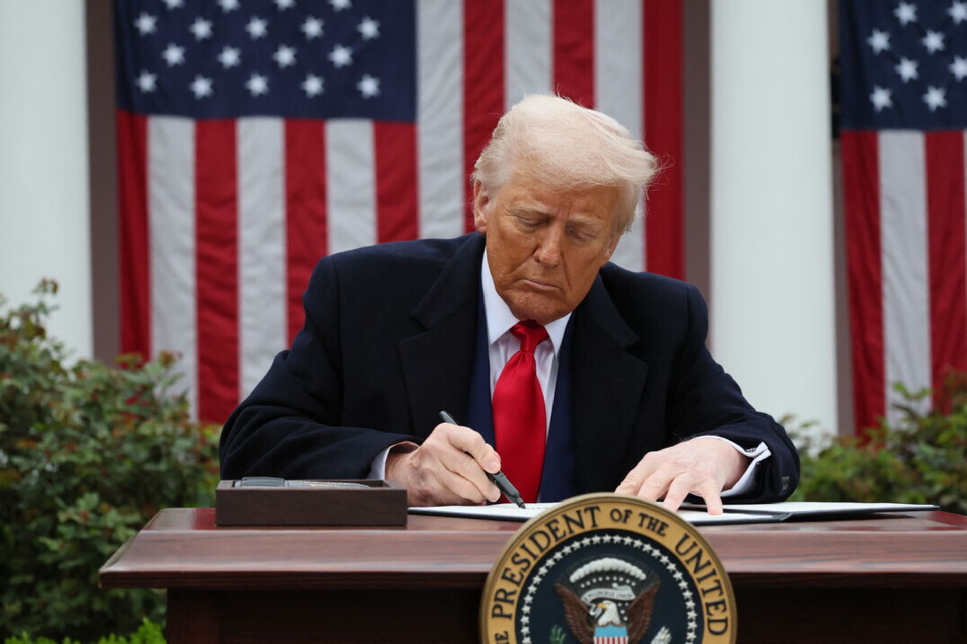 <p>Donald Trump signs an executive order on tariffs, in the Rose Garden at the White House on April 2, 2025.</p>
