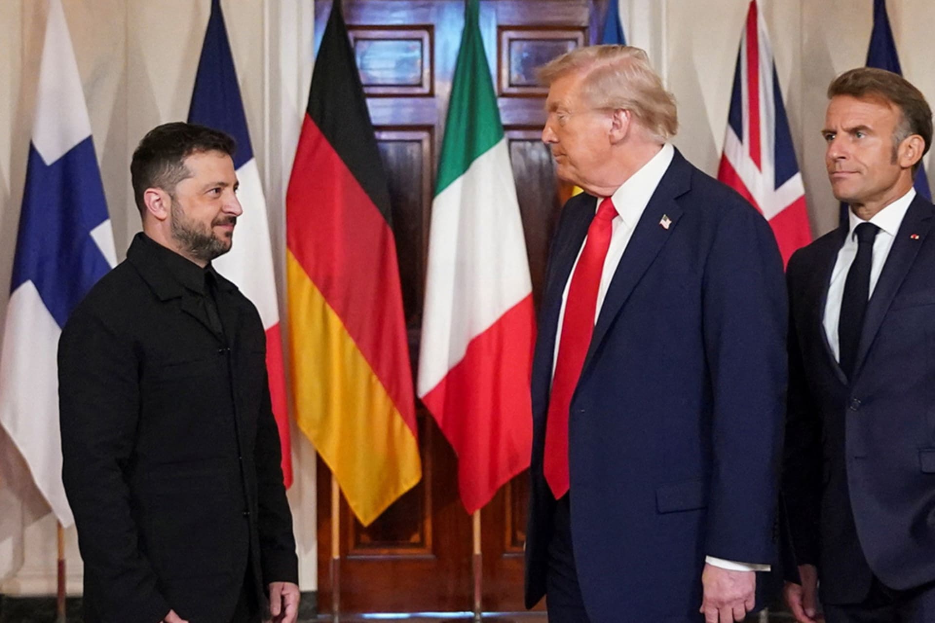 <p>U.S. President Donald Trump, Ukrainian President Volodymyr Zelenskyy and French President Emmanuel Macron stand for a photo, amid negotiations to end the Russian war in Ukraine, at the White House in Washington, D.C., August 18, 2025.</p>