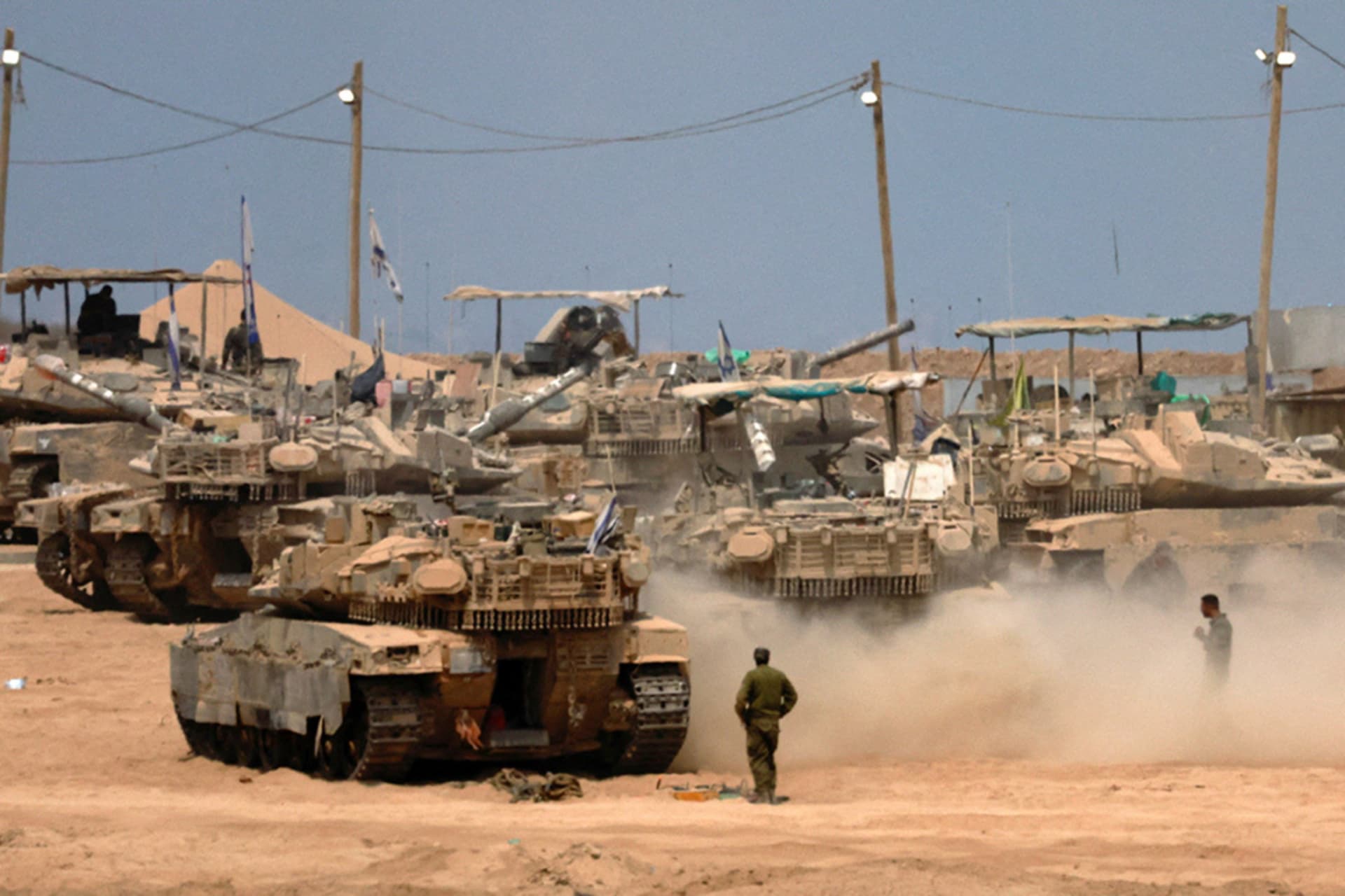 <p>A view shows military vehicles on the Israeli side of the border with Gaza, as seen from Israel, August 12, 2025.</p>
