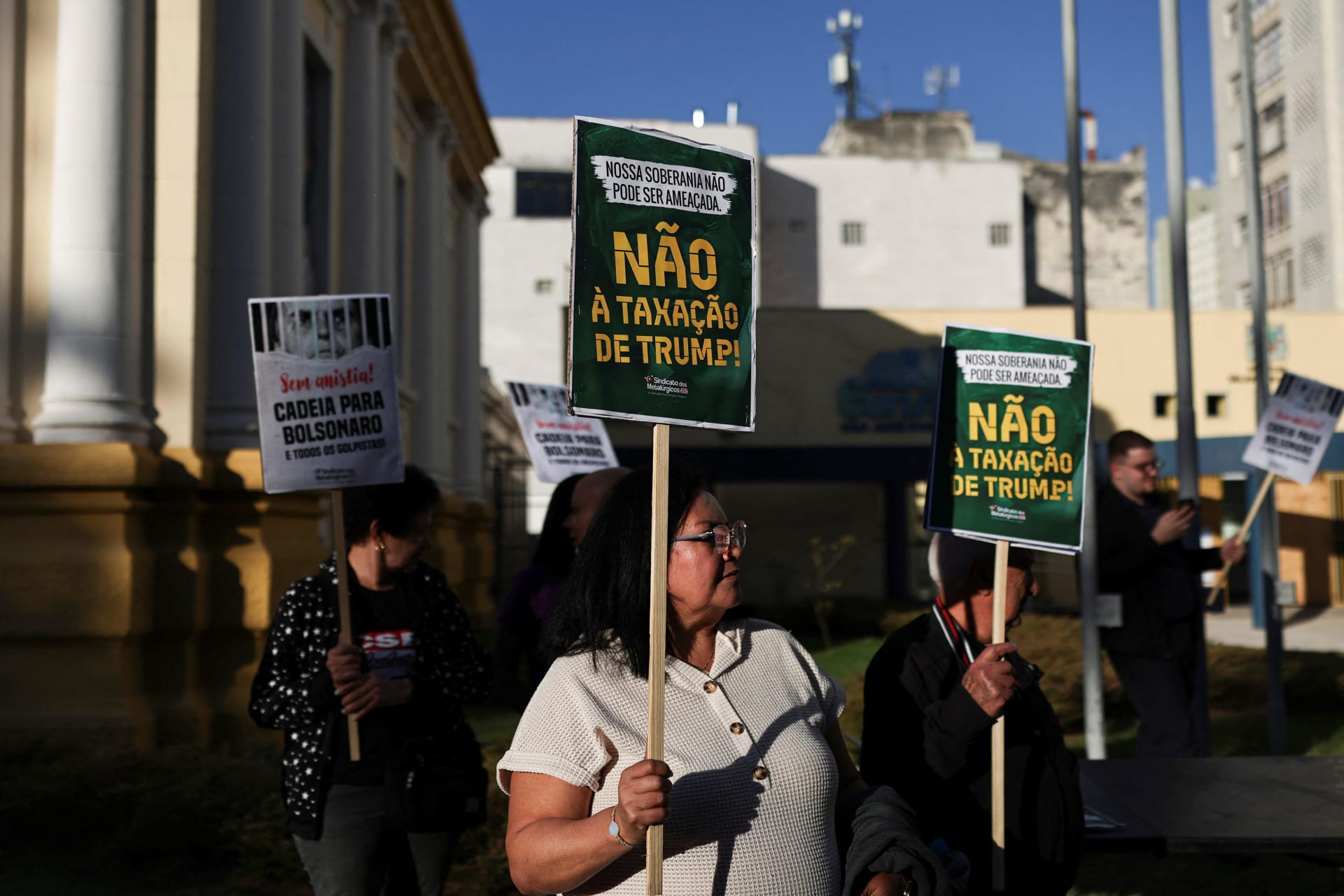 <p>A demonstrator holds a sign reading in Portuguese “No to Trump’s taxation”, during a protest against the tariffs on Brazilian products imposed by U.S. President Donald Trump, in Sao Jose dos Campos, Brazil July 29, 2025. </p>
