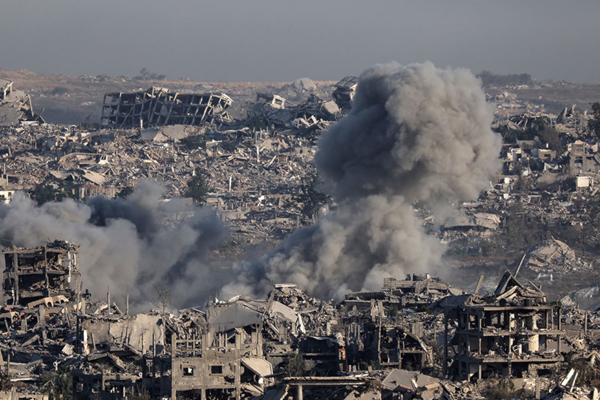 <p>Smoke billows over destroyed buildings in Gaza during an Israeli strike, July 17, 2025.</p>
