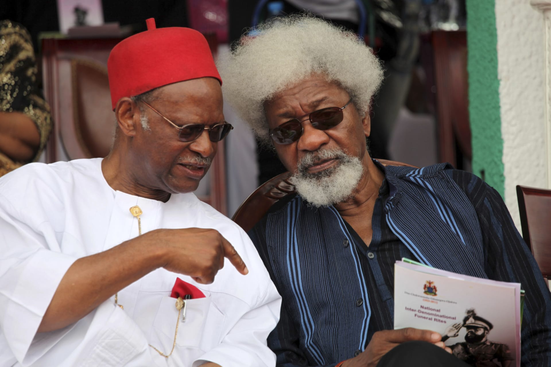 <p>Emeka Anyaoku sits with Wole Soyinka during the national funeral ceremony for Odumegwu Ojukwu in Enugu, Nigeria on March 1, 2012.</p>
