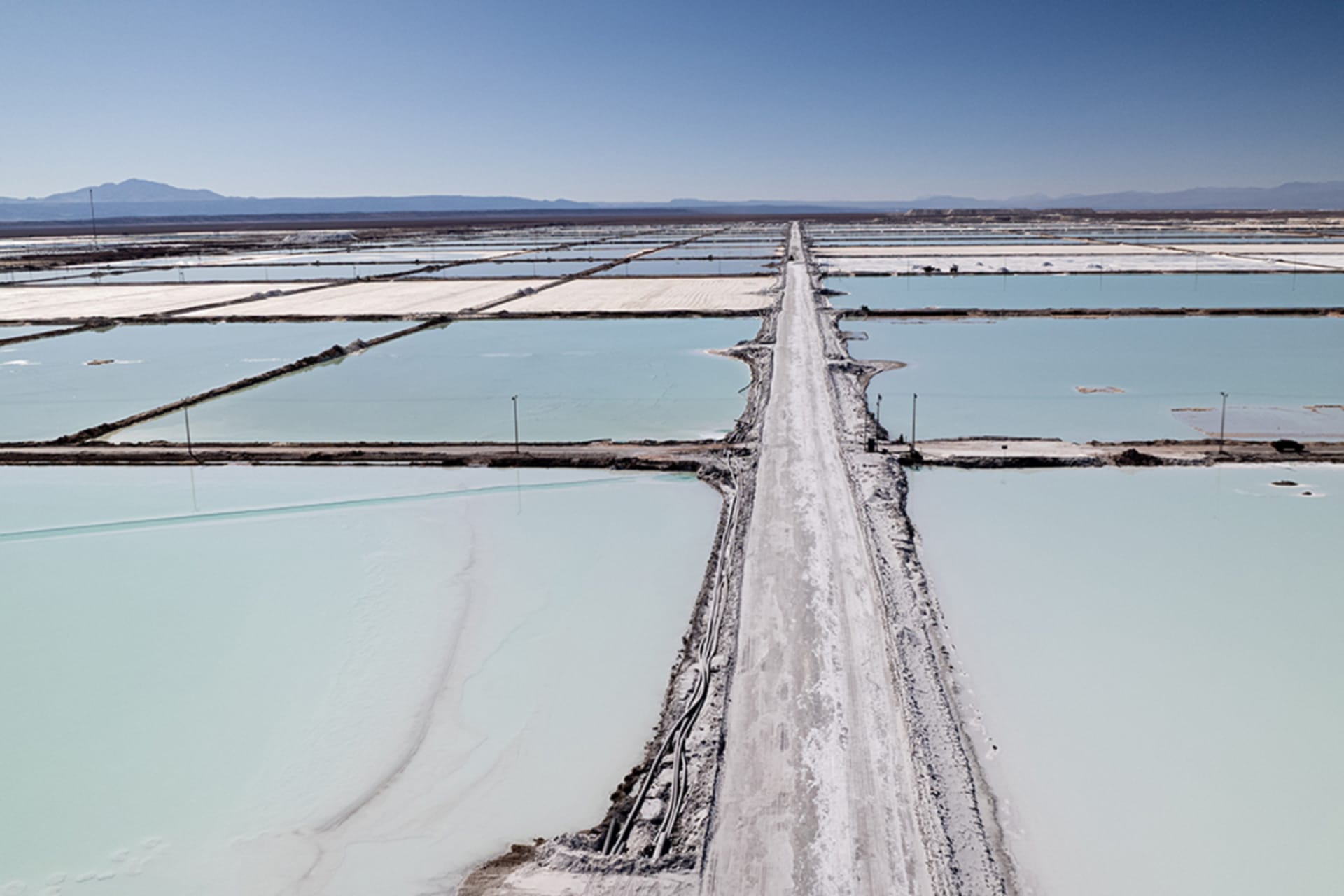 <p>An aerial view of lithium mining pits in Atacama Salt Flat, Chile.</p>
