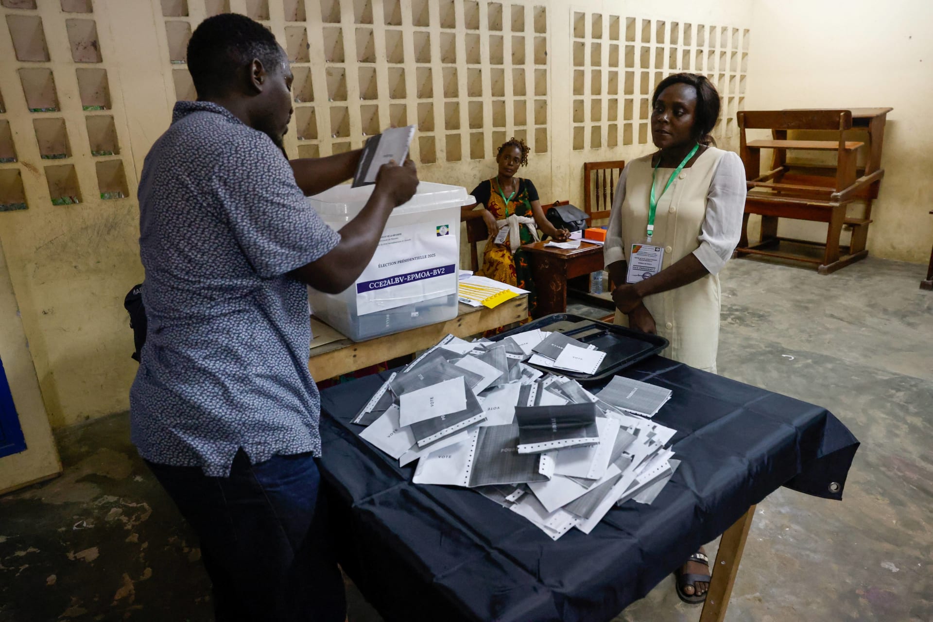 <p>Electoral workers count votes at a polling station inside a school during the presidential election, in Libreville, Gabon on April 12, 2025.</p>
