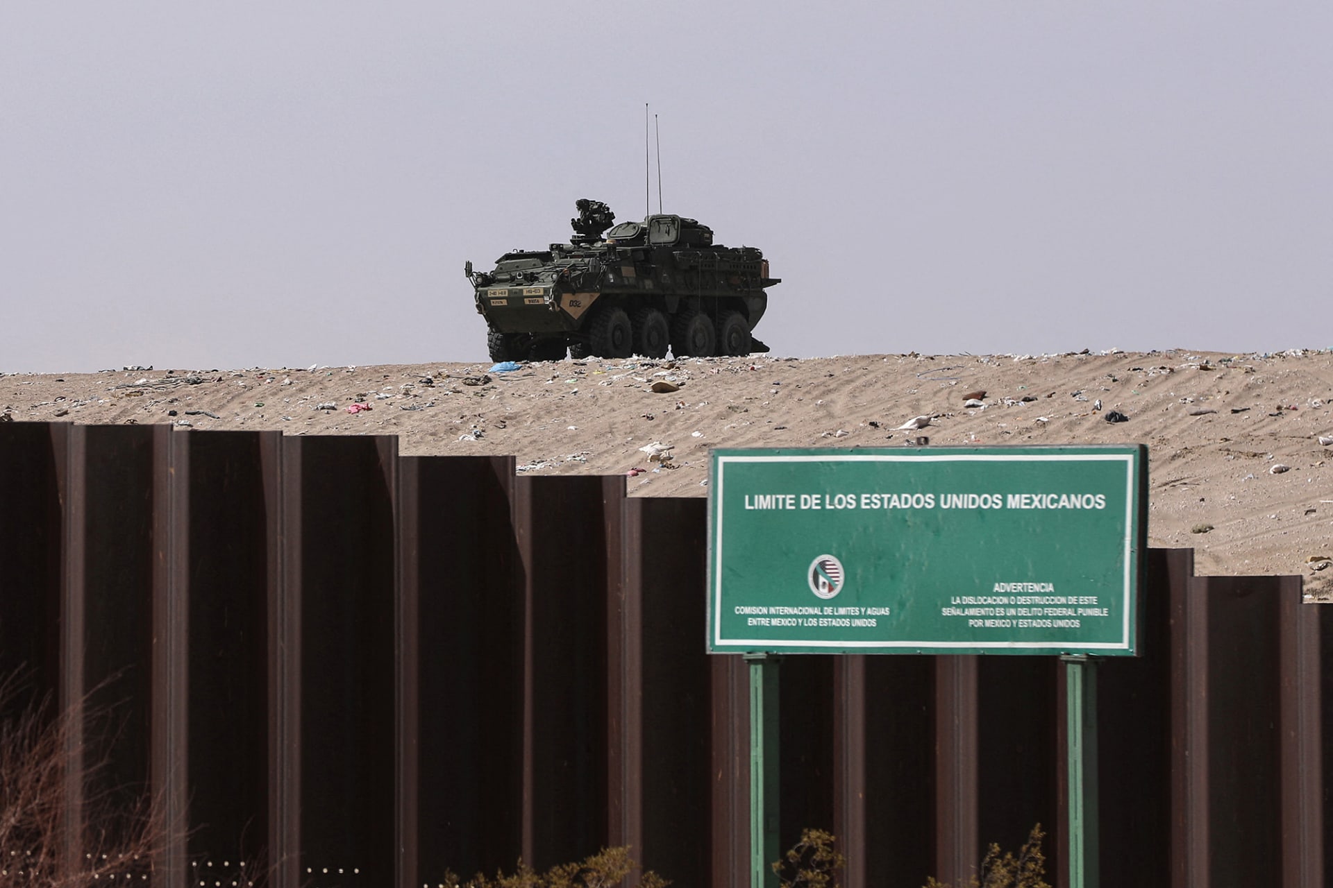 <p>A vehicle patrols near a sign reading “United States of Mexico limits” in New Mexico.</p>
