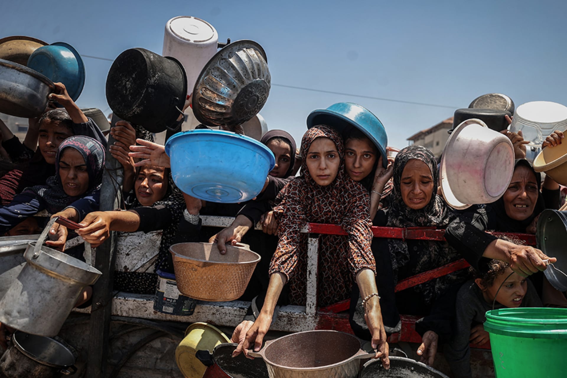 <p>Crowds form in Gaza City as Palestinians line up to receive food distributed by a charity amid an ongoing Israeli blockade.</p>
