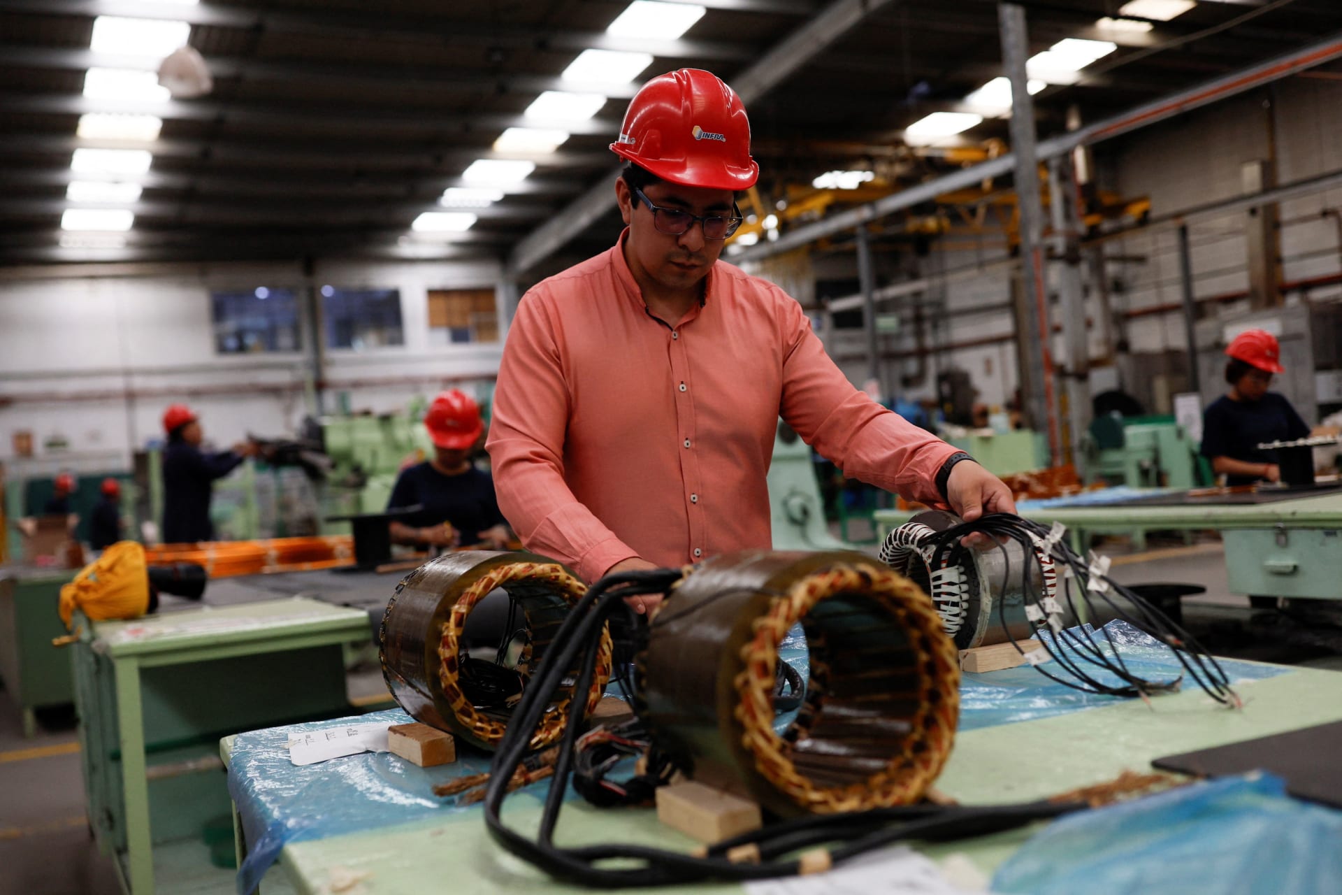 <p>Engineer Julio Hernandez checks a part of an electric car’s motor, designed and built by DINA and MegaFlux at Taruk plant, in Mexico City, Mexico April 2, 2025.</p>
