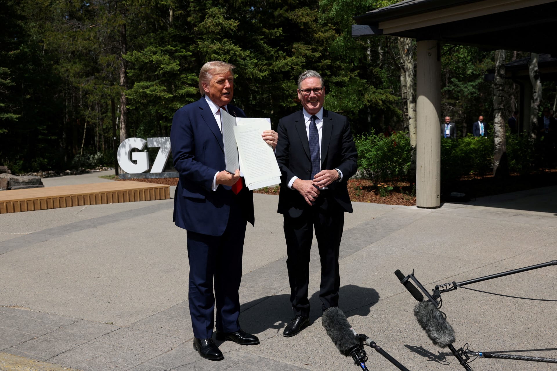 <p>U.S. President Donald Trump holds a signed Trade Agreement with Britain during a meeting with British Prime Minister Keir Starmer, at the G7 summit, in Kananaskis, Alberta, Canada, June 16, 2025.</p>
