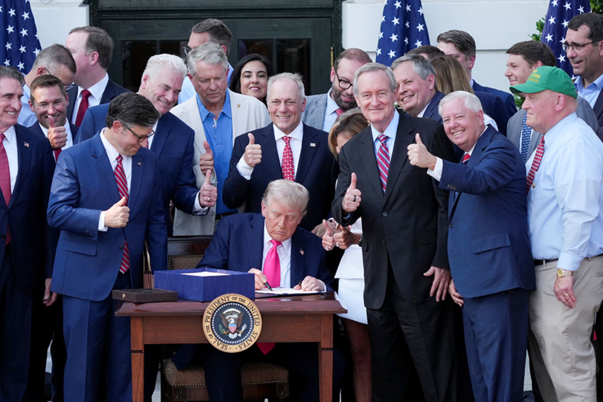 <p>U.S. President Donald Trump signs a sweeping spending and tax legislation at the White House in Washington, D.C., U.S., July 4, 2025.</p>
