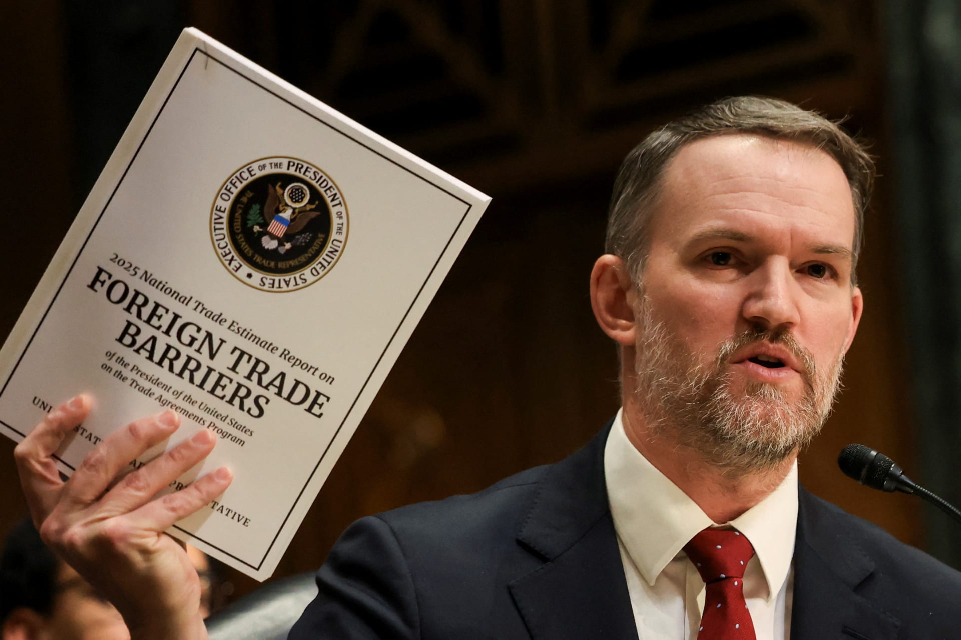 <p>U.S. Trade Representative Jamieson Greer holds a copy of “Foreign Trade Barriers” as he testifies before a Senate Finance Committee hearing on U.S. President Donald Trump’s trade policy, on Capitol Hill in Washington, D.C., U.S., April 8, 2025.</p>
