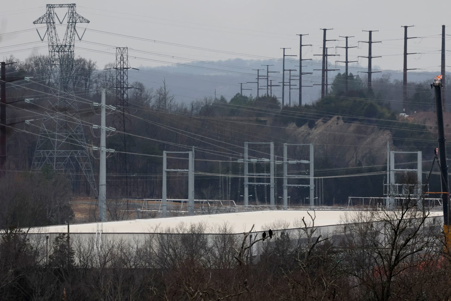 <p>A building complex that houses Compass Datacenters is partially visible from a nearby neighborhood in Broadlands, Virginia, U.S., March 13, 2025.</p>
