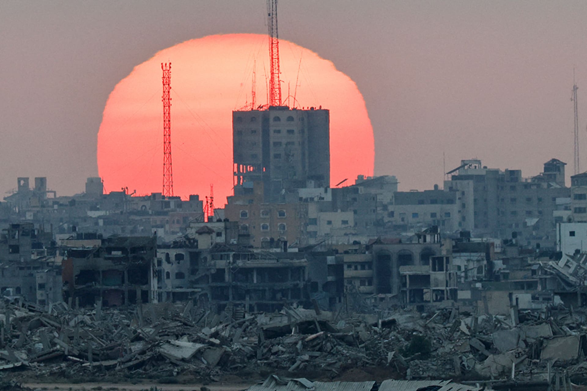 <p>The sun sets over Gaza, as seen from Israel, July 1, 2025.</p>