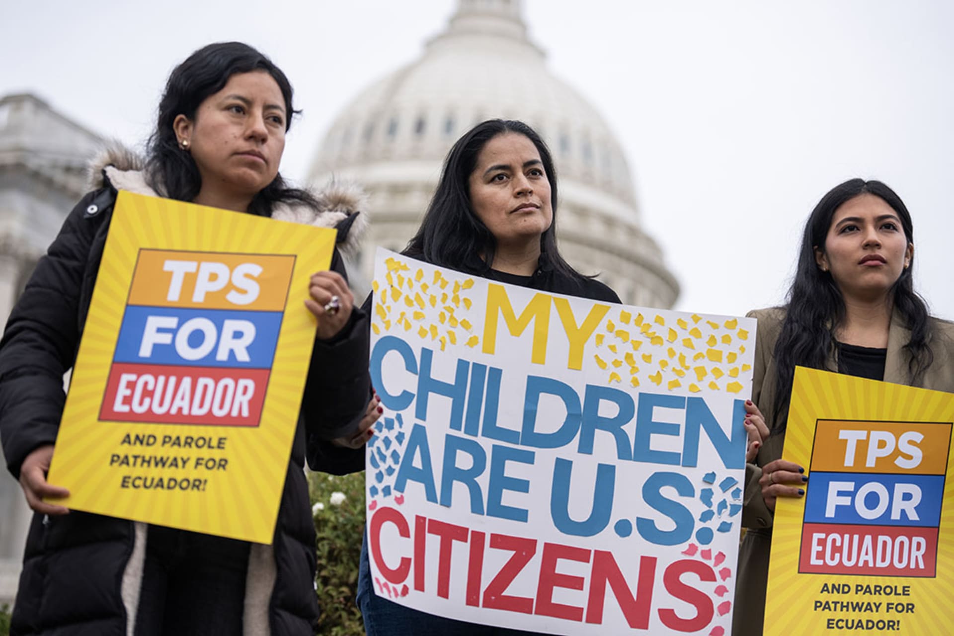 <p>Activists listen to Rep. Alexandria Ocasio-Cortez speak about TPS outside the Capitol.</p>

