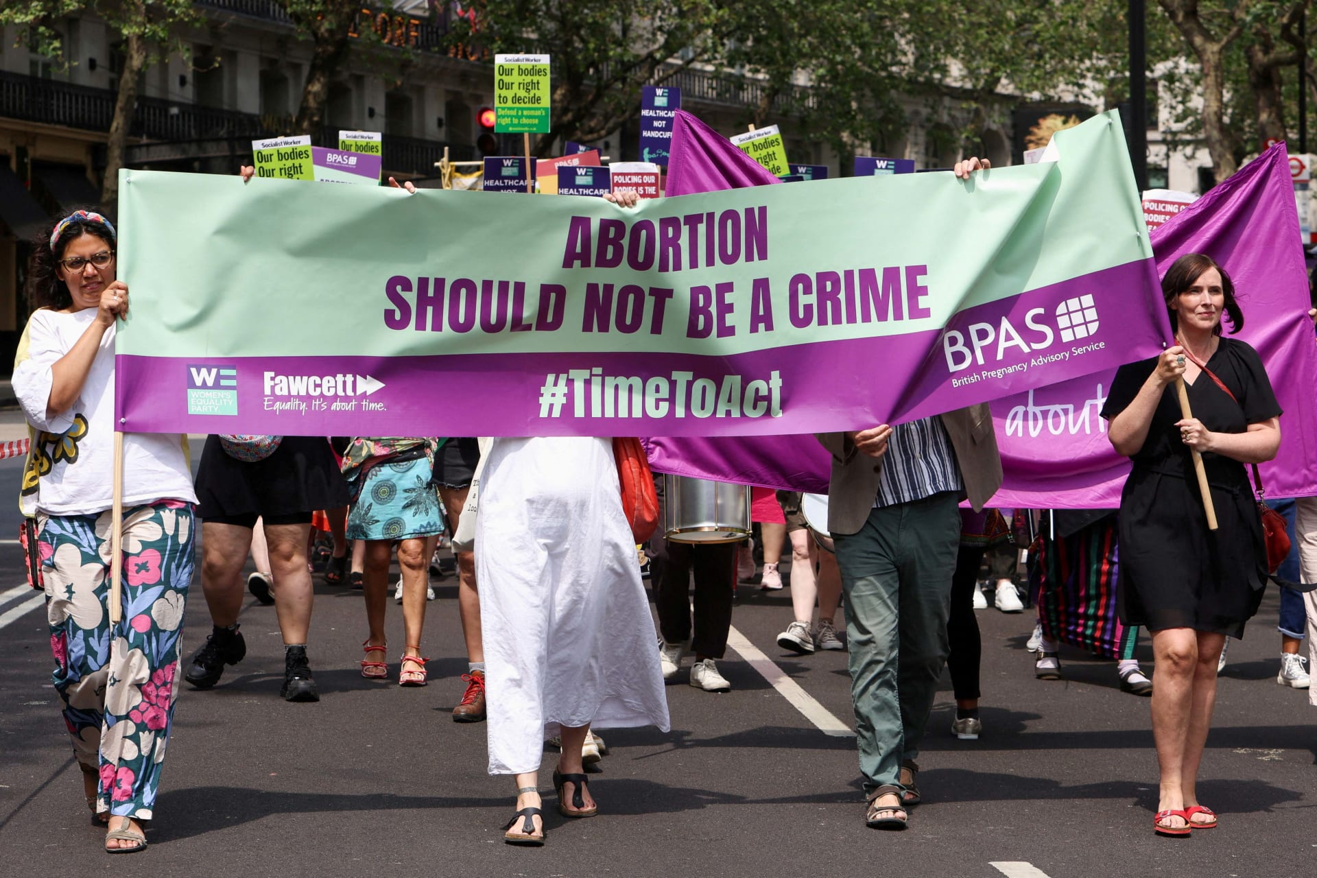 <p>People march during a protest calling for abortion law reform in London, Britain June 17, 2023. </p>
