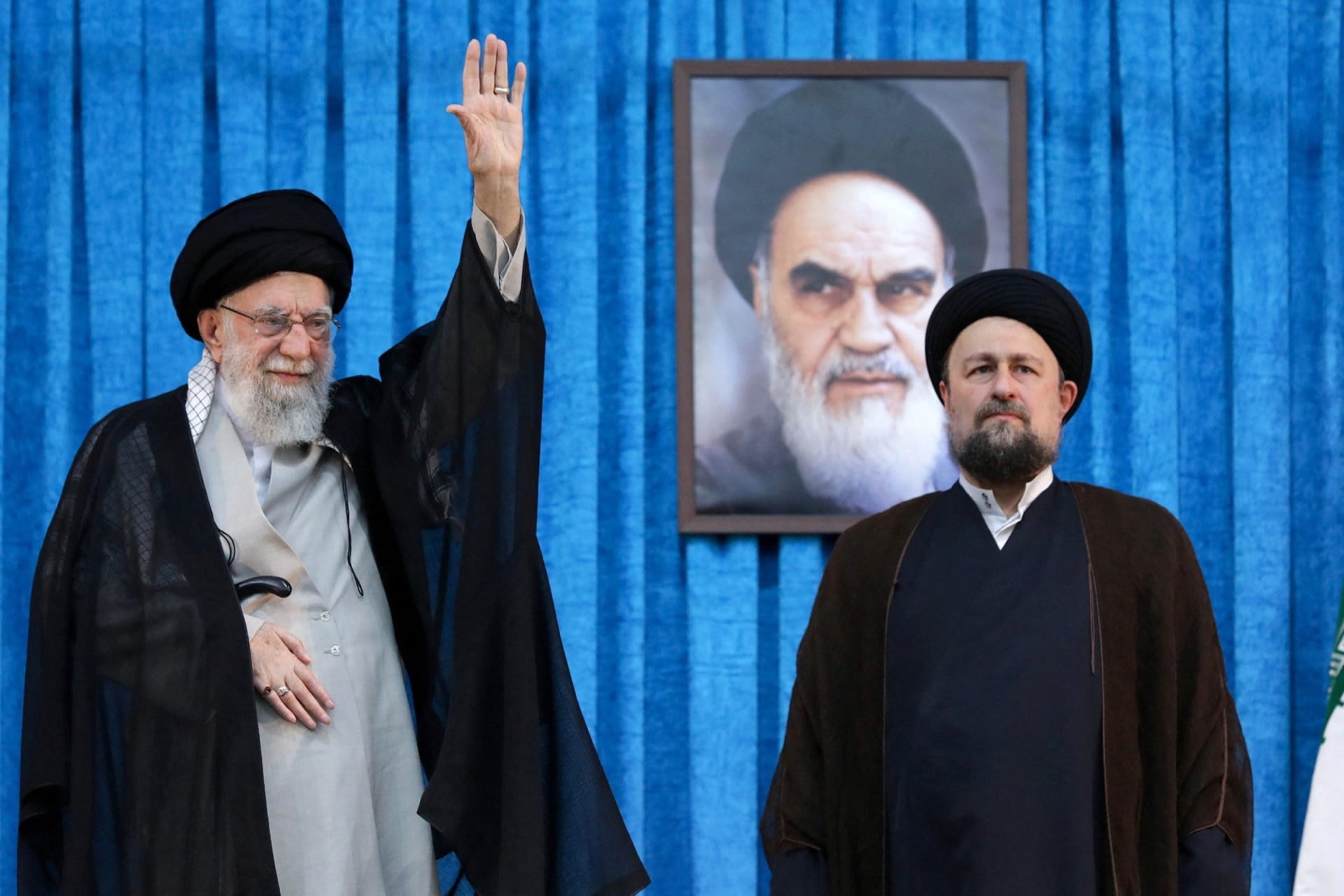 <p>Hassan Khomein, Ayatollah Ruhollah Khomeini’s grandson, stands next to Iran’s Supreme Leader Ayatollah Ali Khamenei, June 4, 2025.</p>
