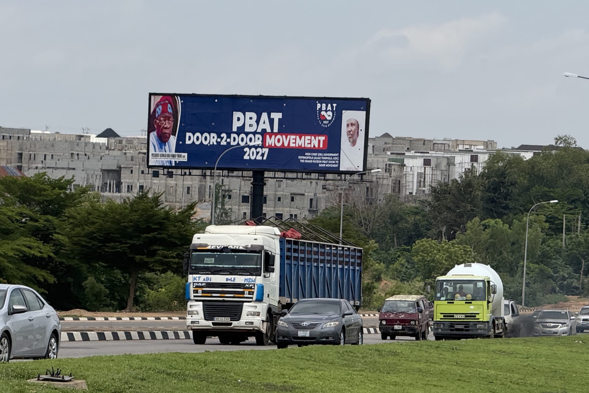 <p>A billboard depicting President Bola Tinubu and Government Ekpemupolo in support of Tinubu’s reelection campaign stands above a highway in Abuja, Nigeria on June 10, 2025.</p>

