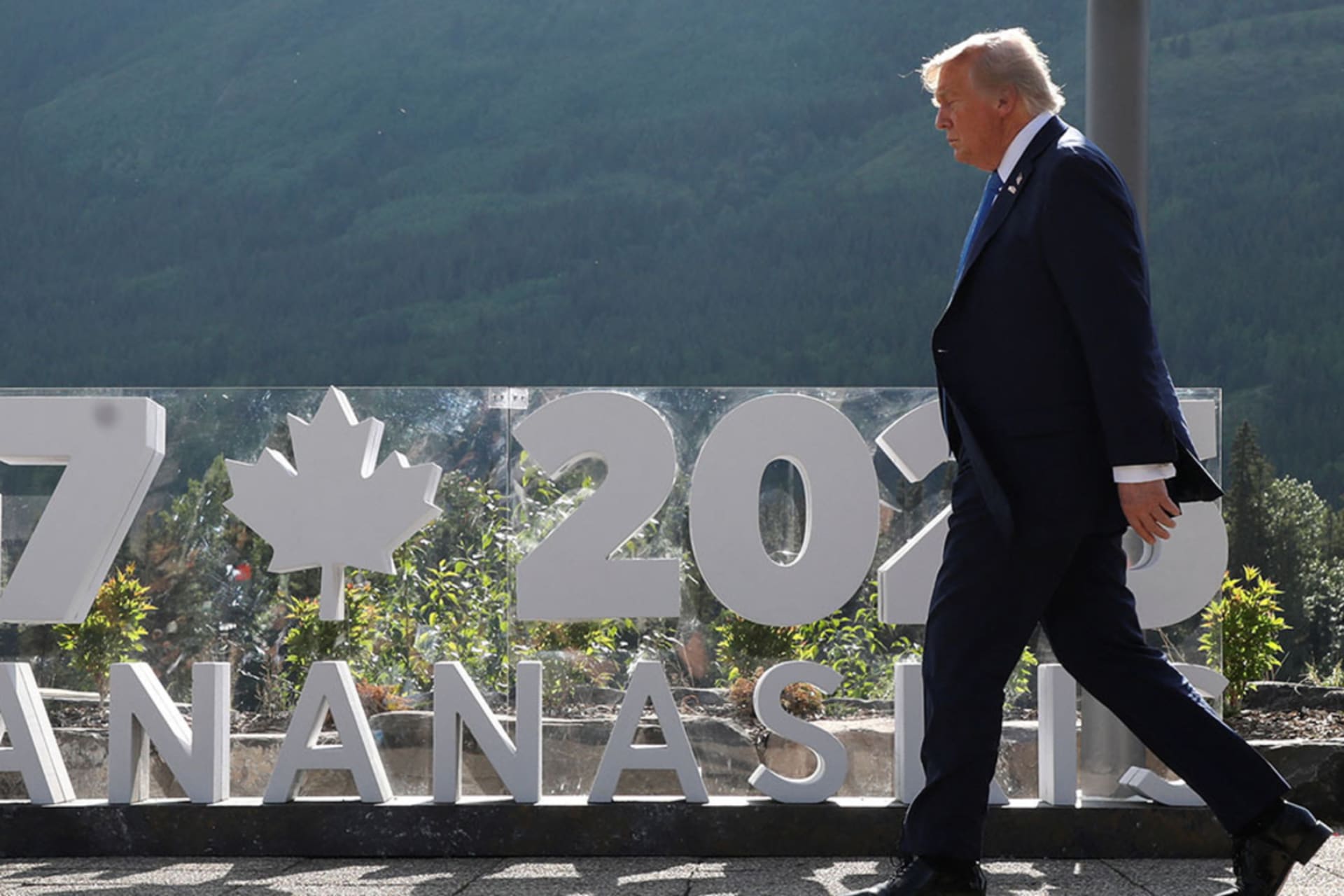 <p>U.S. President Donald Trump walks to have a family photo taken at the G7 Summit in Kananaskis, Alberta, Canada, June 16, 2025. </p>