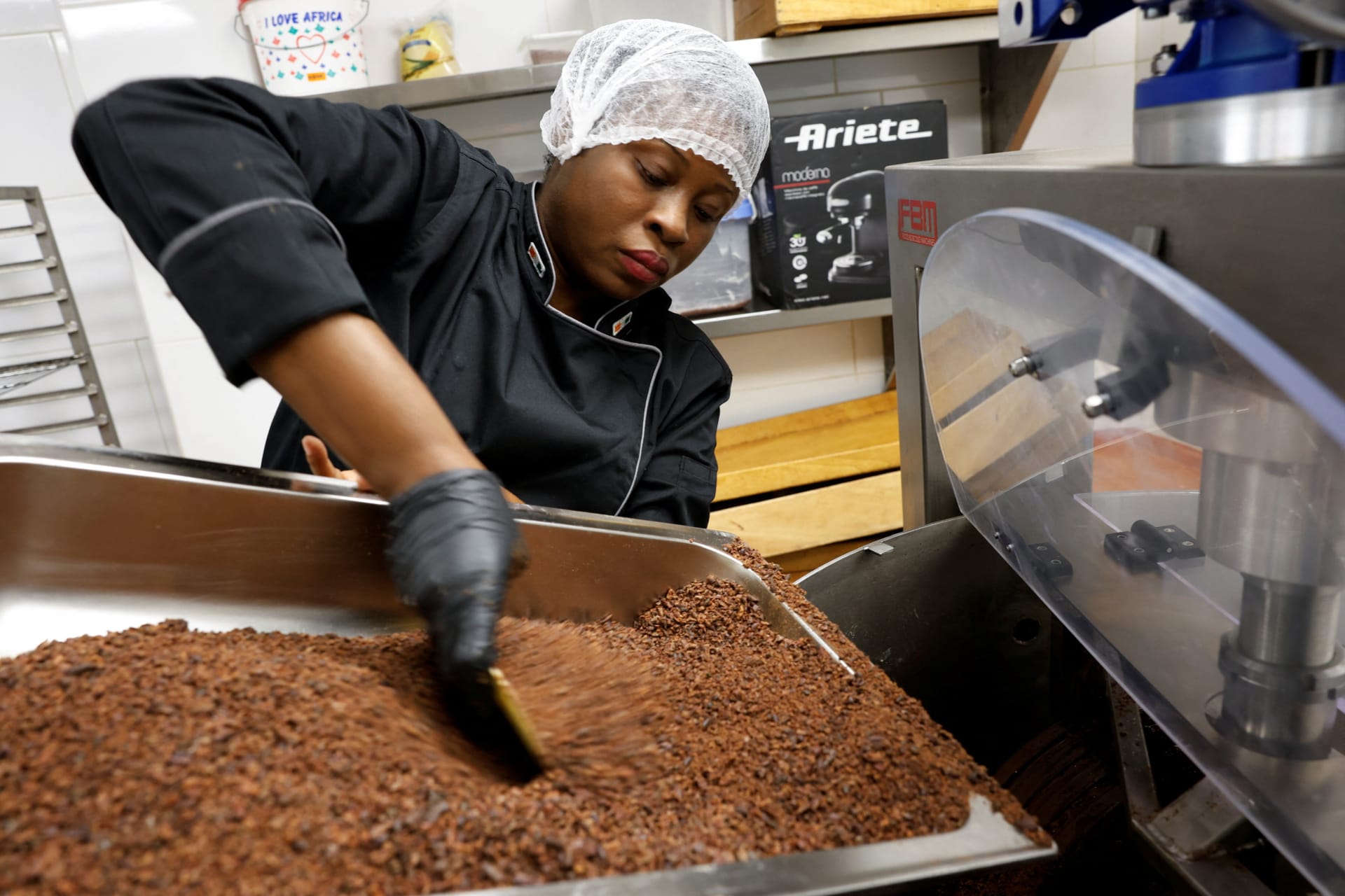 <p>Viviane Kouame, Ivorian chocolate artisan, works during the production of chocolates at Chocovi, her chocolate factory in Abidjan, Ivory Coast, May 10, 2024</p>
