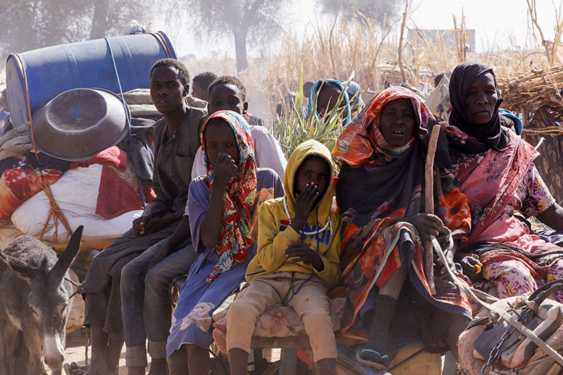 <p>Displaced people ride an animal-drawn cart, following attacks on the Zamzam displacement camp, in the town of Tawila in Sudan on April 15, 2025.</p>
