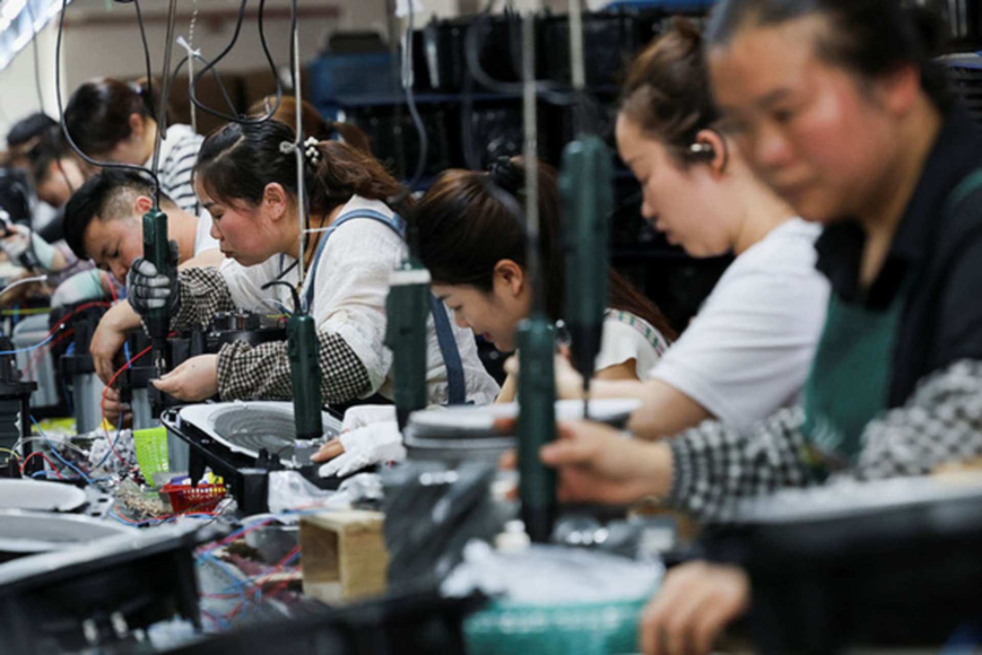 <p>Employees of Cixi Gstar Electronic Appliance assemble air fryers in the factory in Ningbo, China, May 19, 2025.</p>

