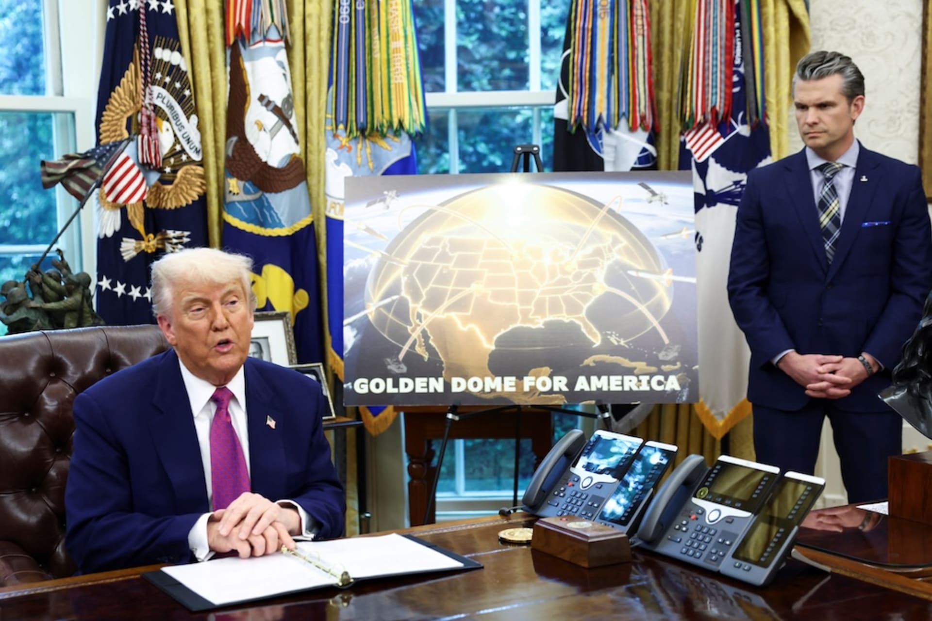 <p>U.S. President Donald Trump makes an announcement regarding the Golden Dome missile defense shield next to U.S. Defense Secretary Pete Hegseth in the Oval Office of the White House in Washington, D.C., U.S., May 20, 2025.</p>
