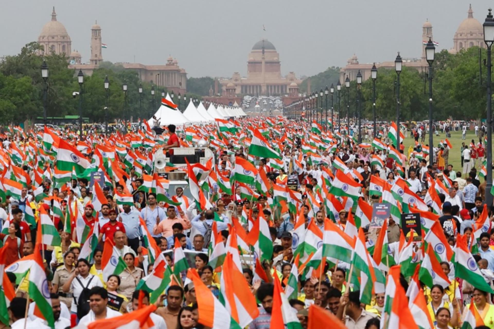 <p>Indians in New Delhi wave flags in support of the Indian Armed Forces after the announcement of a ceasefire between India and Pakistan on May 13, 2025</p>
