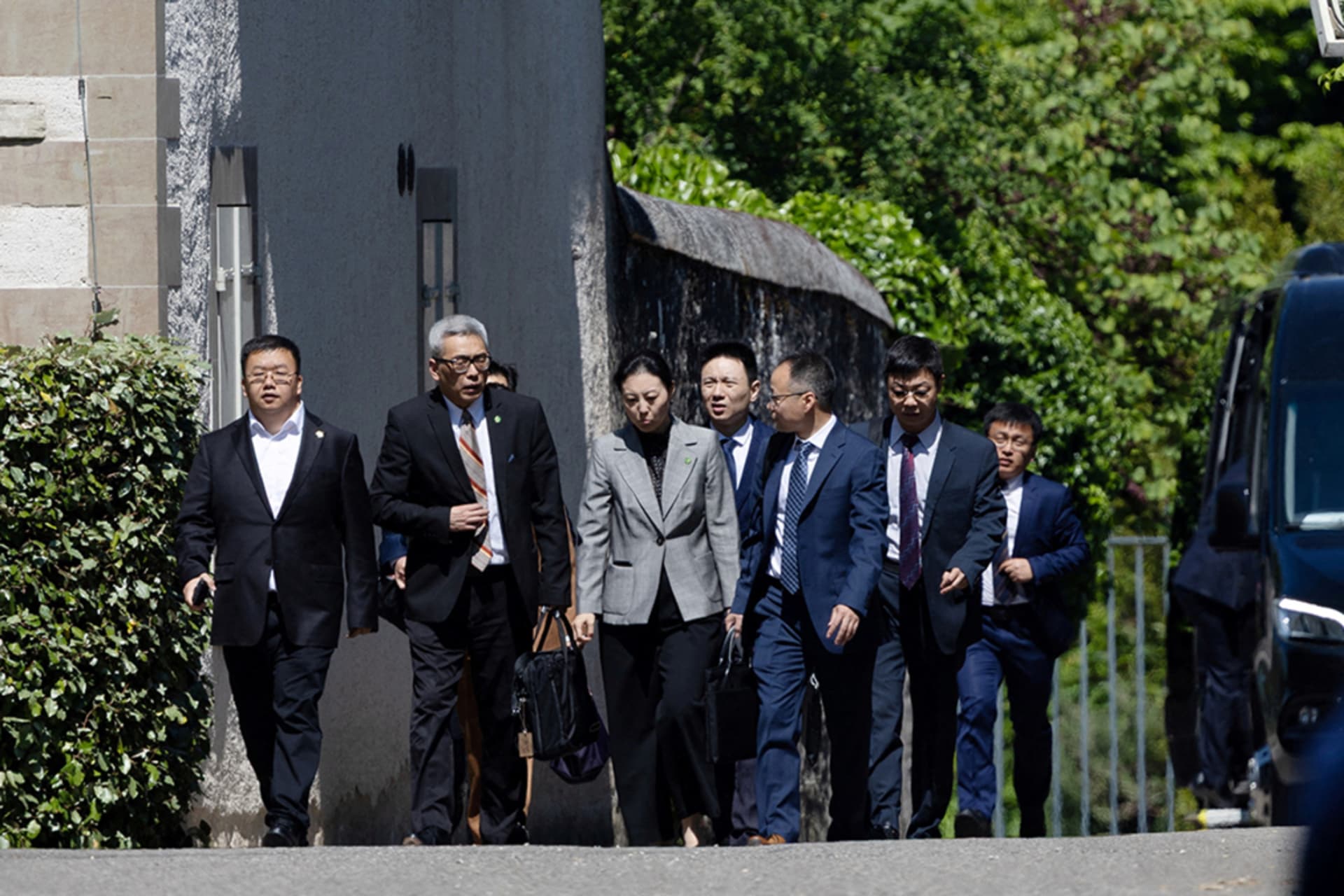 <p>Members of the Chinese delegation leave a residence where trade talks between U.S. and Chinese delegations take place in Geneva.</p>
