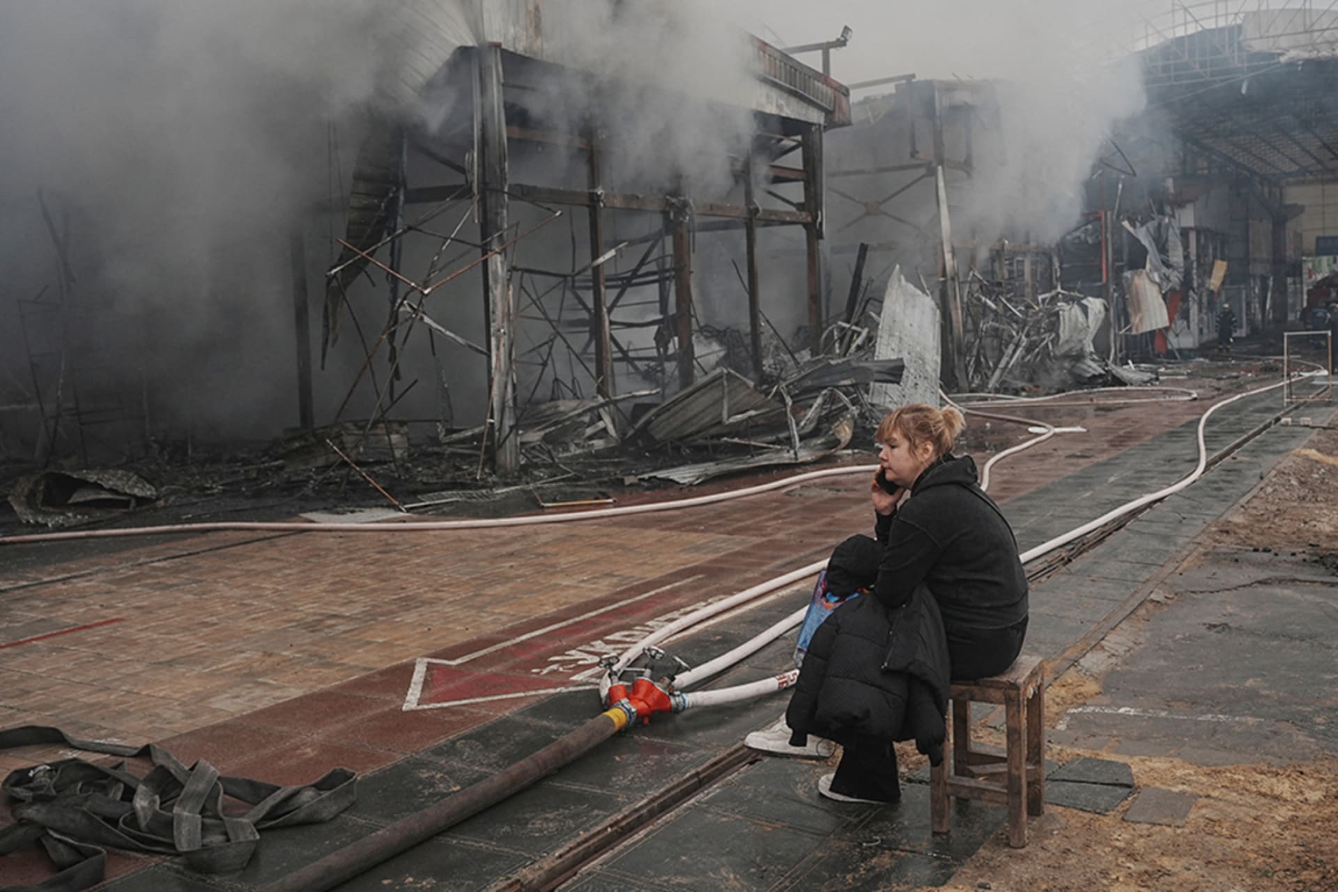 <p>A vendor sits at the site of the Barabashovo market hit by Russian drone strike in Kharkiv, Ukraine.</p>
