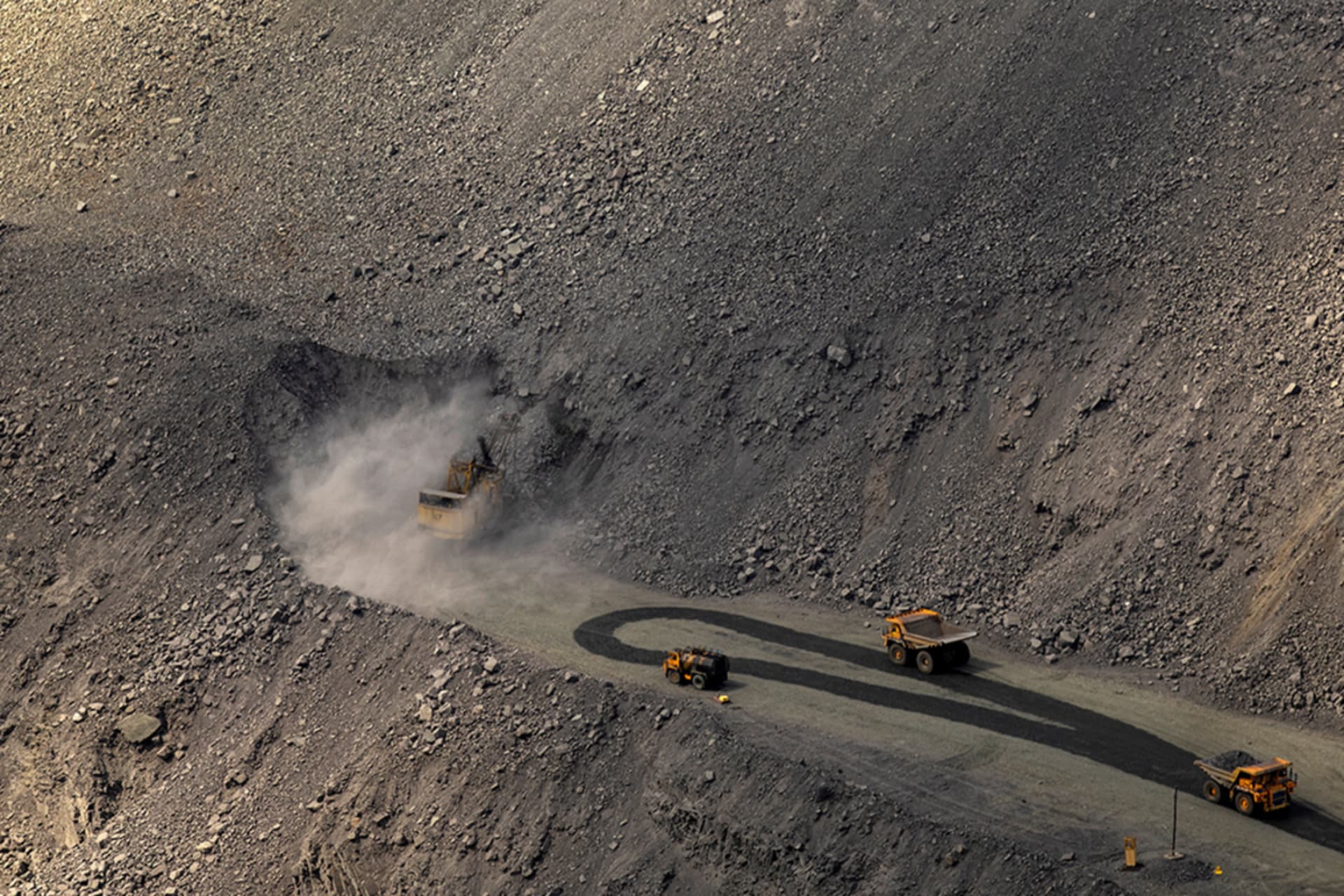 <p>An excavator digs as mining dump trucks drive in the Southern Iron Ore JV open-pit mine, amid Russia’s attack on Ukraine, in Kryvyi Rih, Ukraine April 23, 2025.</p>
