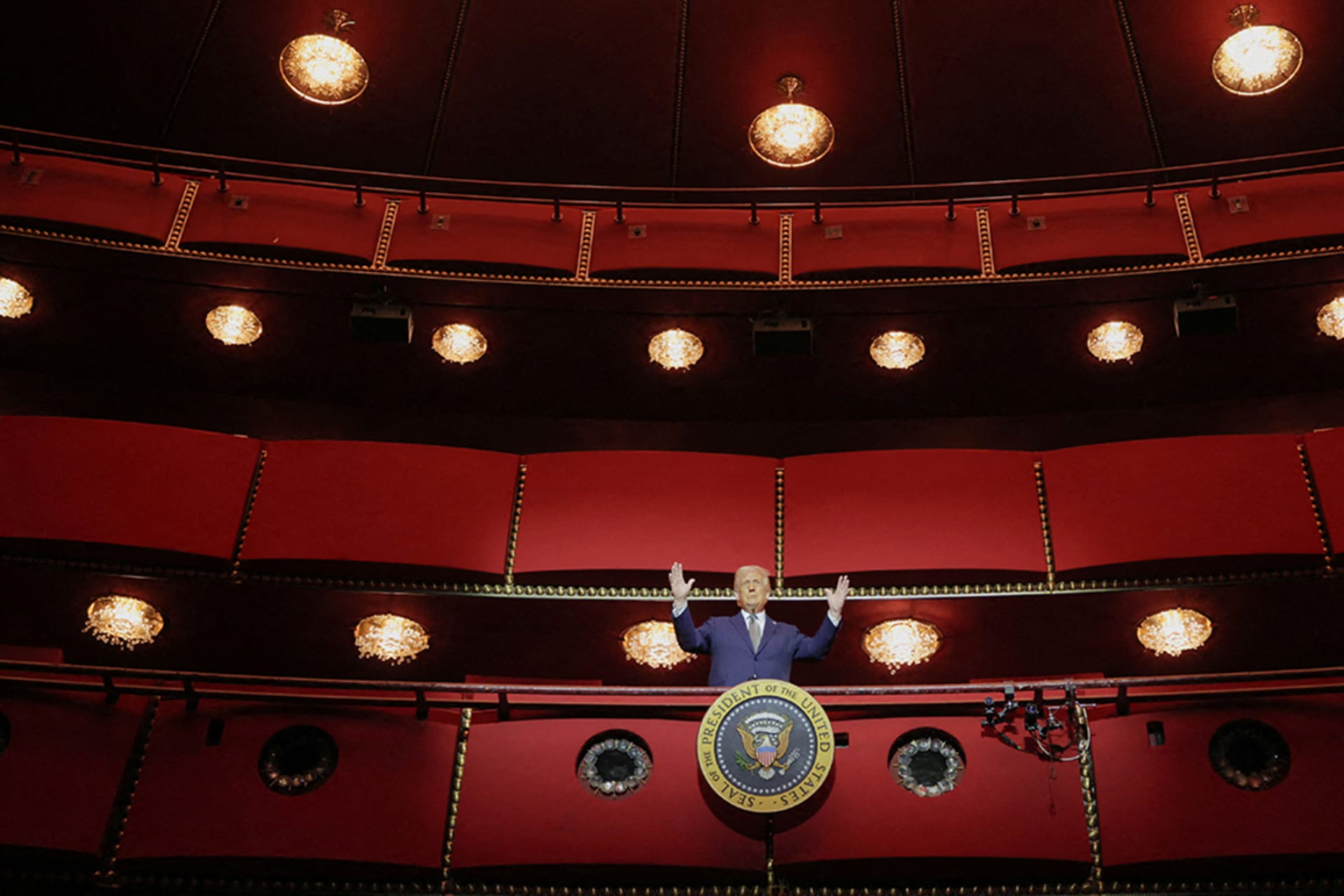 <p>President Trump gestures while he poses for a picture at the presidential box at the Kennedy Center, in Washington, D.C., on March 17.</p>
