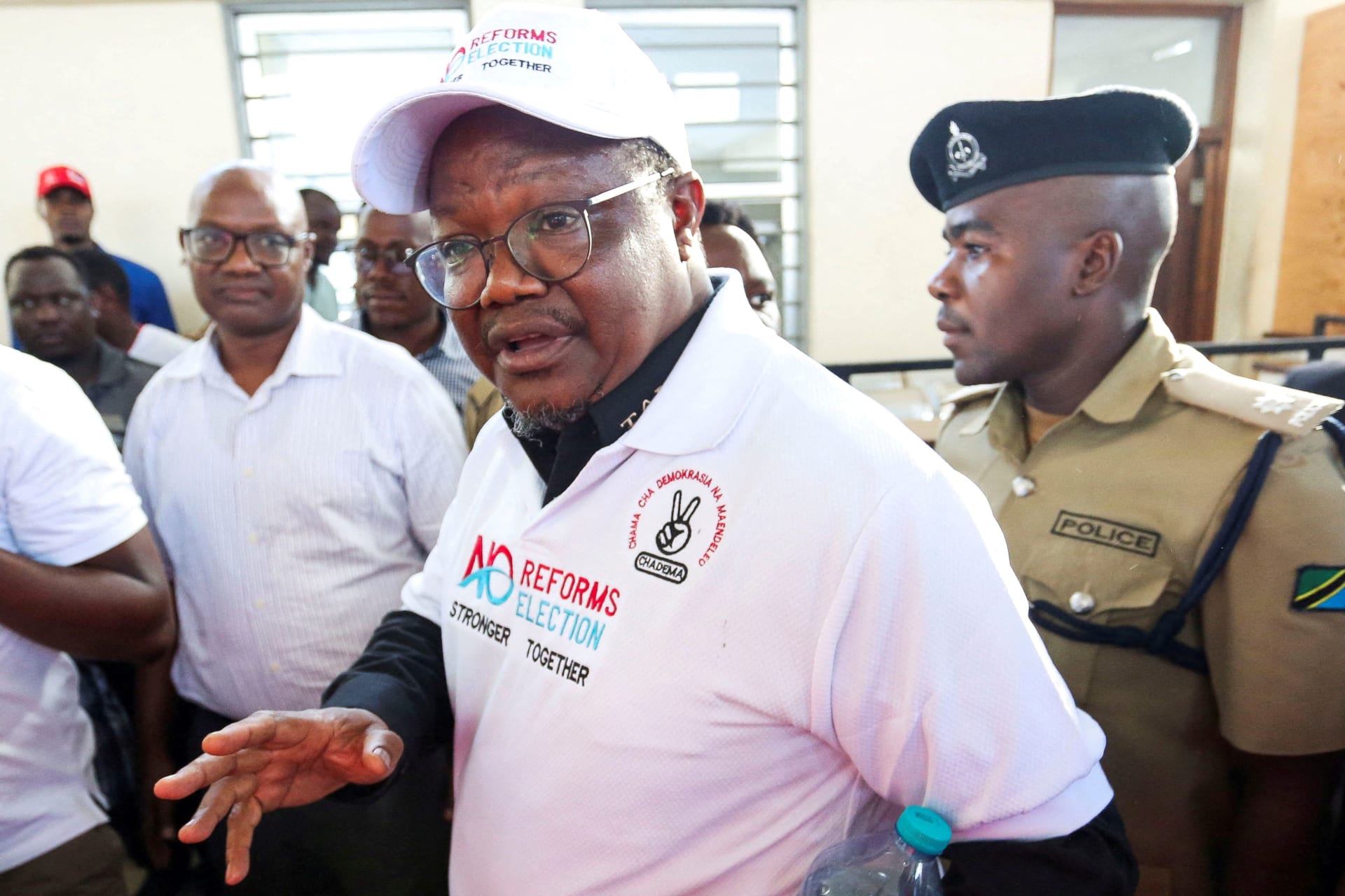 <p>Tanzanian opposition leader and former presidential candidate of Chadema party Tundu Lissu is escorted as he walks at the Kisutu Resident Magistrate Court in Dar es Salaam, Tanzania on April 10, 2025. </p>
