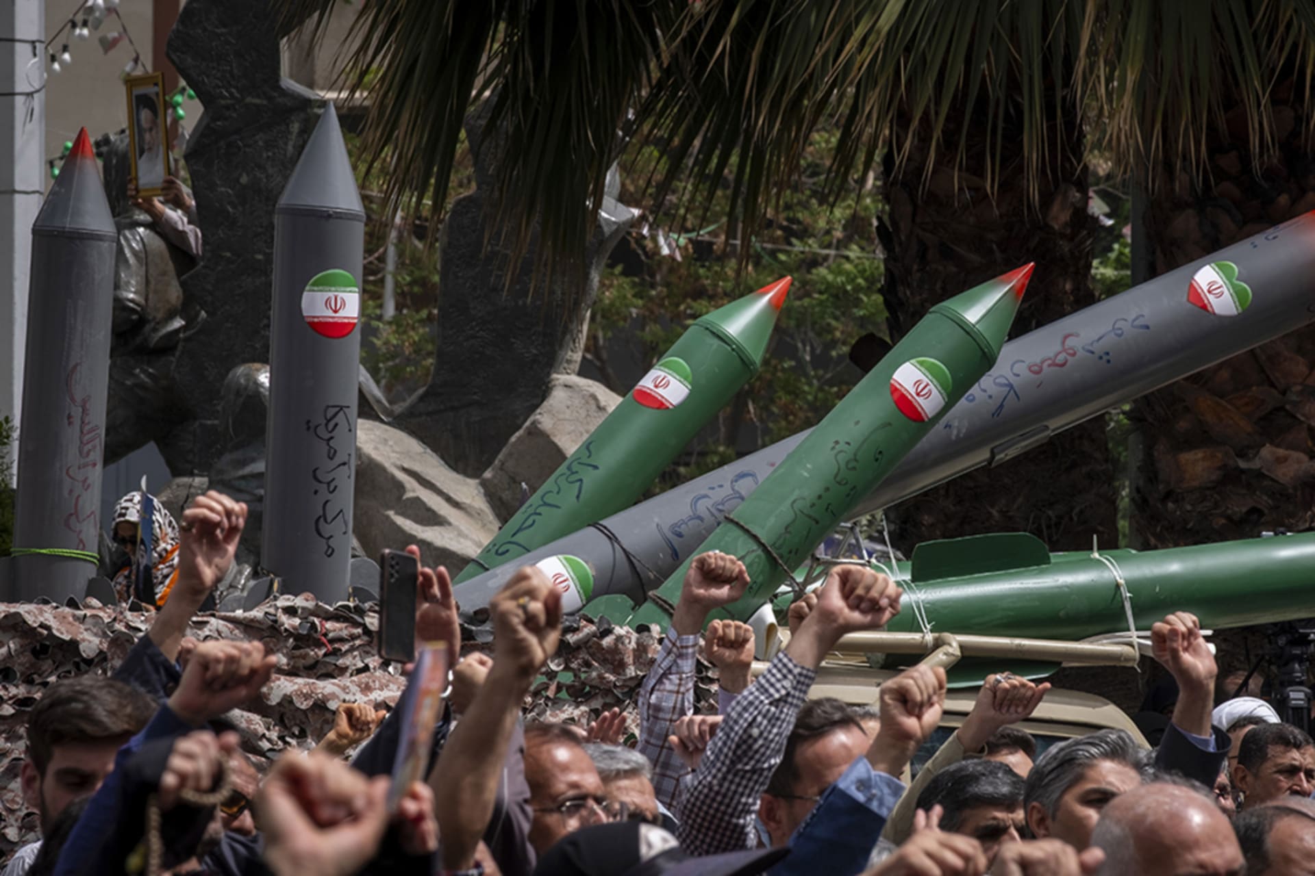 <p>Iranian protesters shout anti-U.S. and anti-Israel slogans while a military vehicle carries a scale model of Iran-made surface-to-surface missiles during an anti-Israeli protest at Palestine Square in downtown Tehran, Iran, on April 9, 2025.</p>
