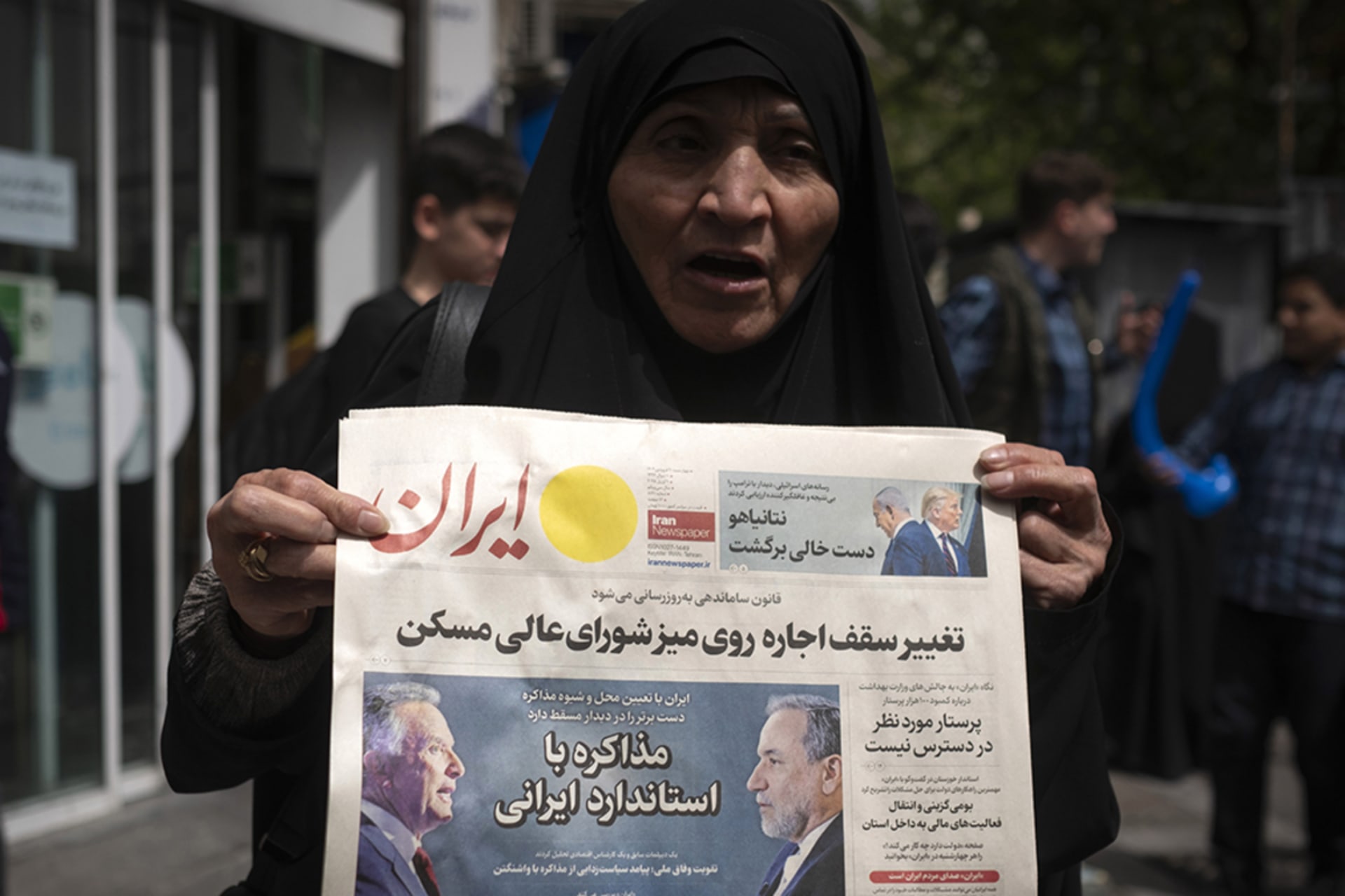 <p>A veiled Iranian woman holds a newspaper featuring portraits of Iranian Foreign Minister Abbas Araghchi and Steve Witkoff, White House special envoy, while she protests against Iran and U.S. negotiations in downtown Tehran, Iran, on April 9, 2025.</p>