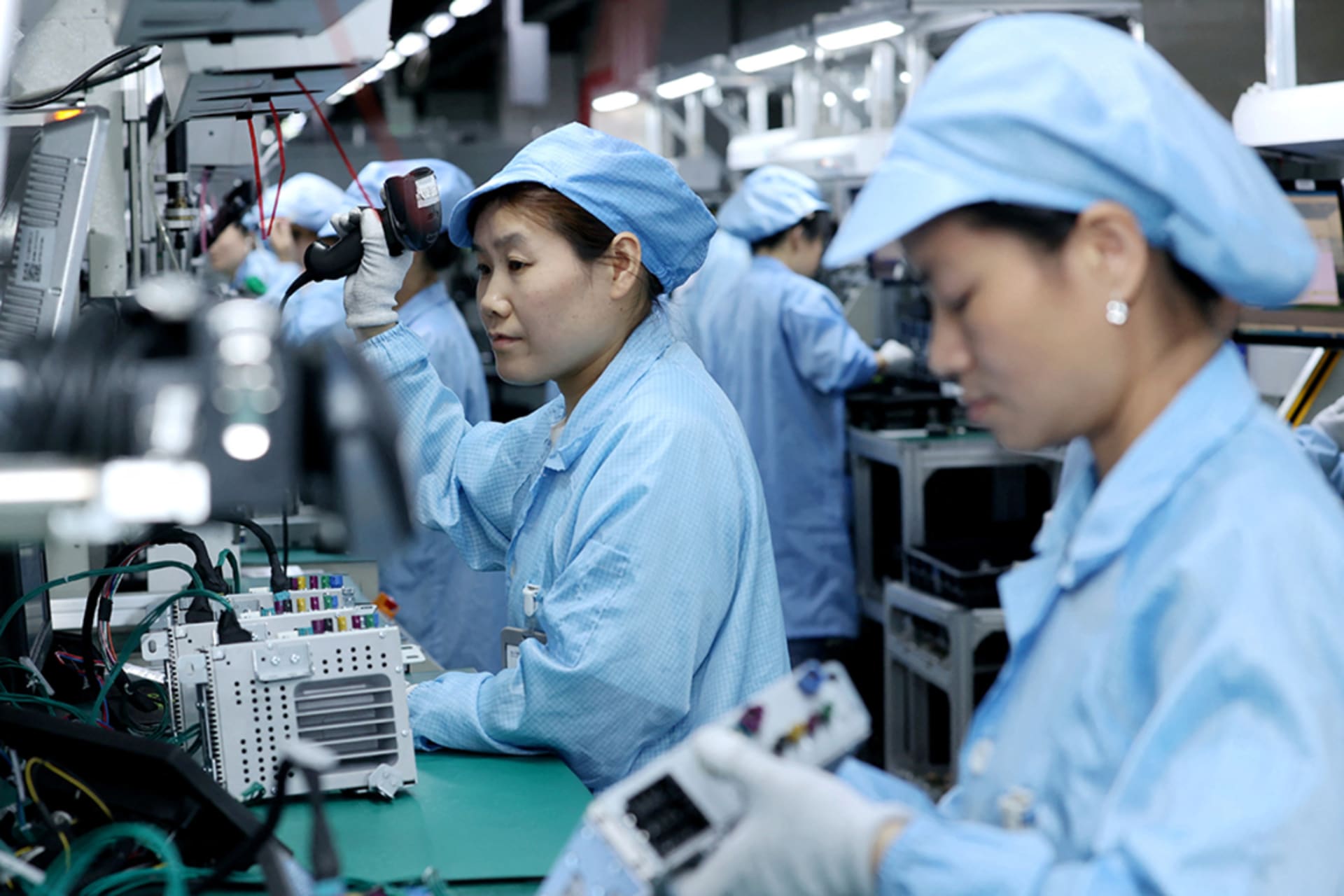 <p>Workers work on a production line manufacturing smart automotive central control navigation products at a factory in the High Tech Industrial Development Zone in Suqian, Jiangsu Province, China April 9, 2025.</p>
