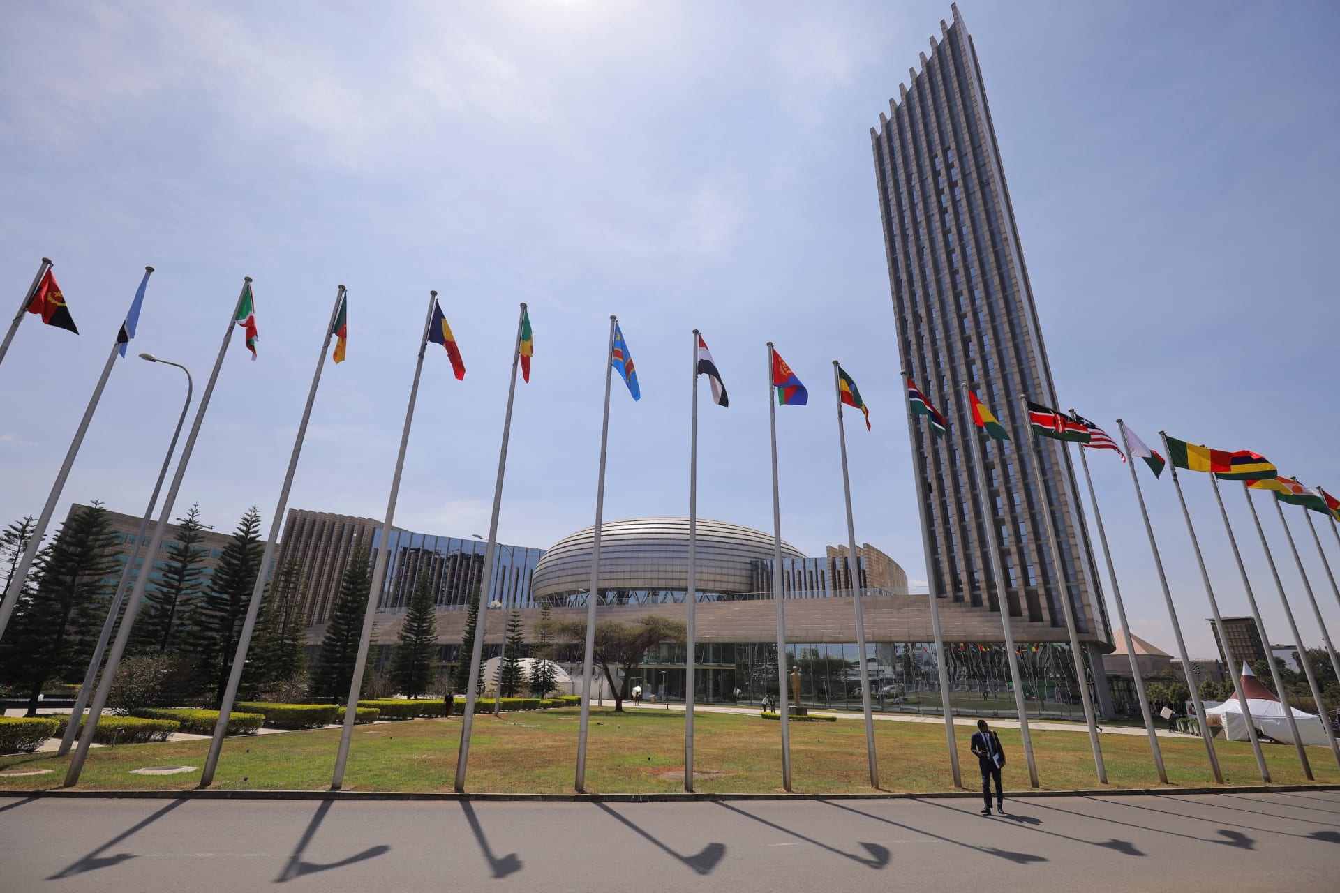 <p>A delegate walks next to African Union (AU) member states’ flags ahead of the 38th Ordinary Session of the Heads of State and Government of the African Union at the African Union Commission headquarters in Addis Ababa, Ethiopia, on February 14, 2025. </p>

