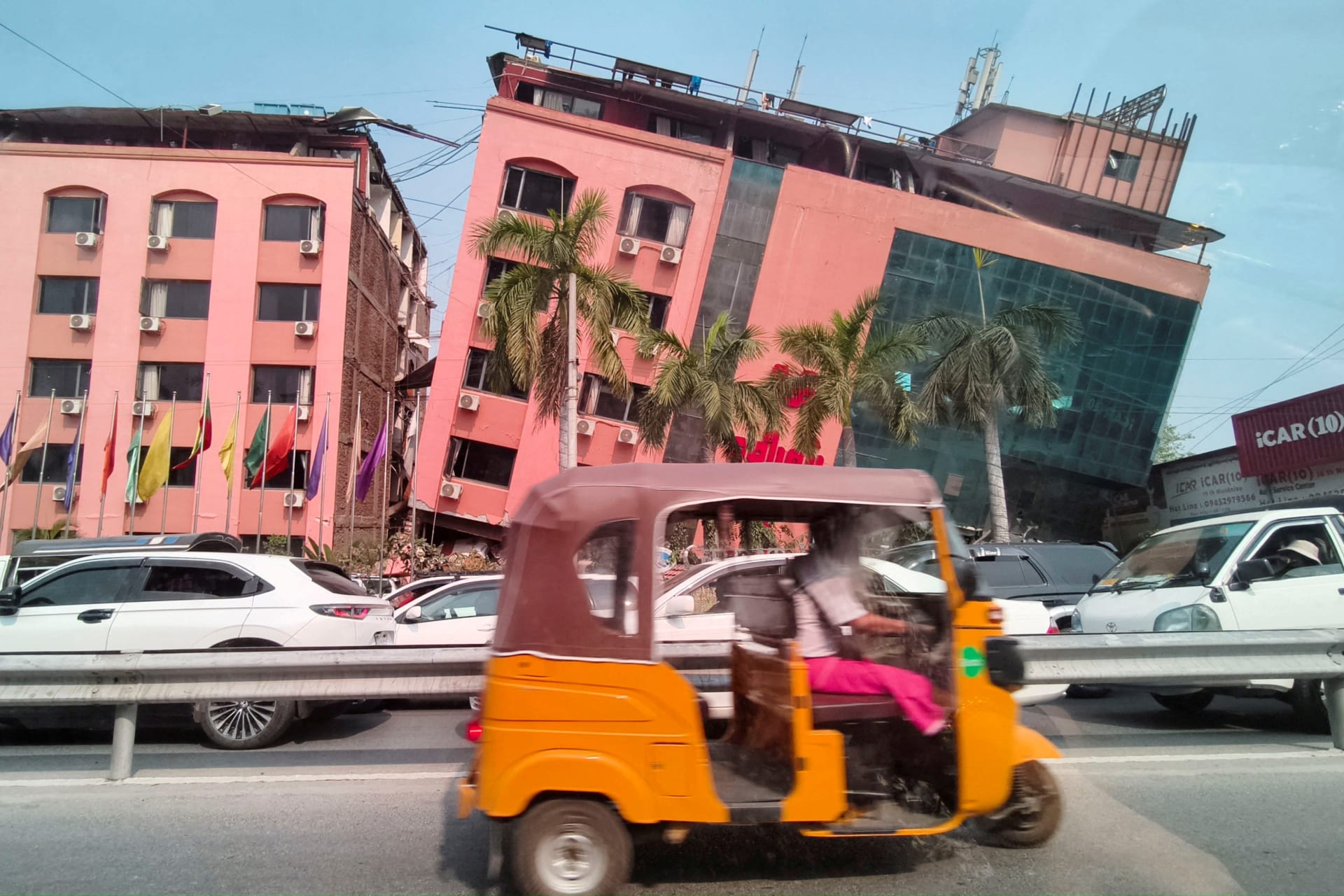 <p>Motorists ride past a damaged building after a strong earthquake struck central Myanmar, in Mandalay, Myanmar, on March 28, 2025. </p>
