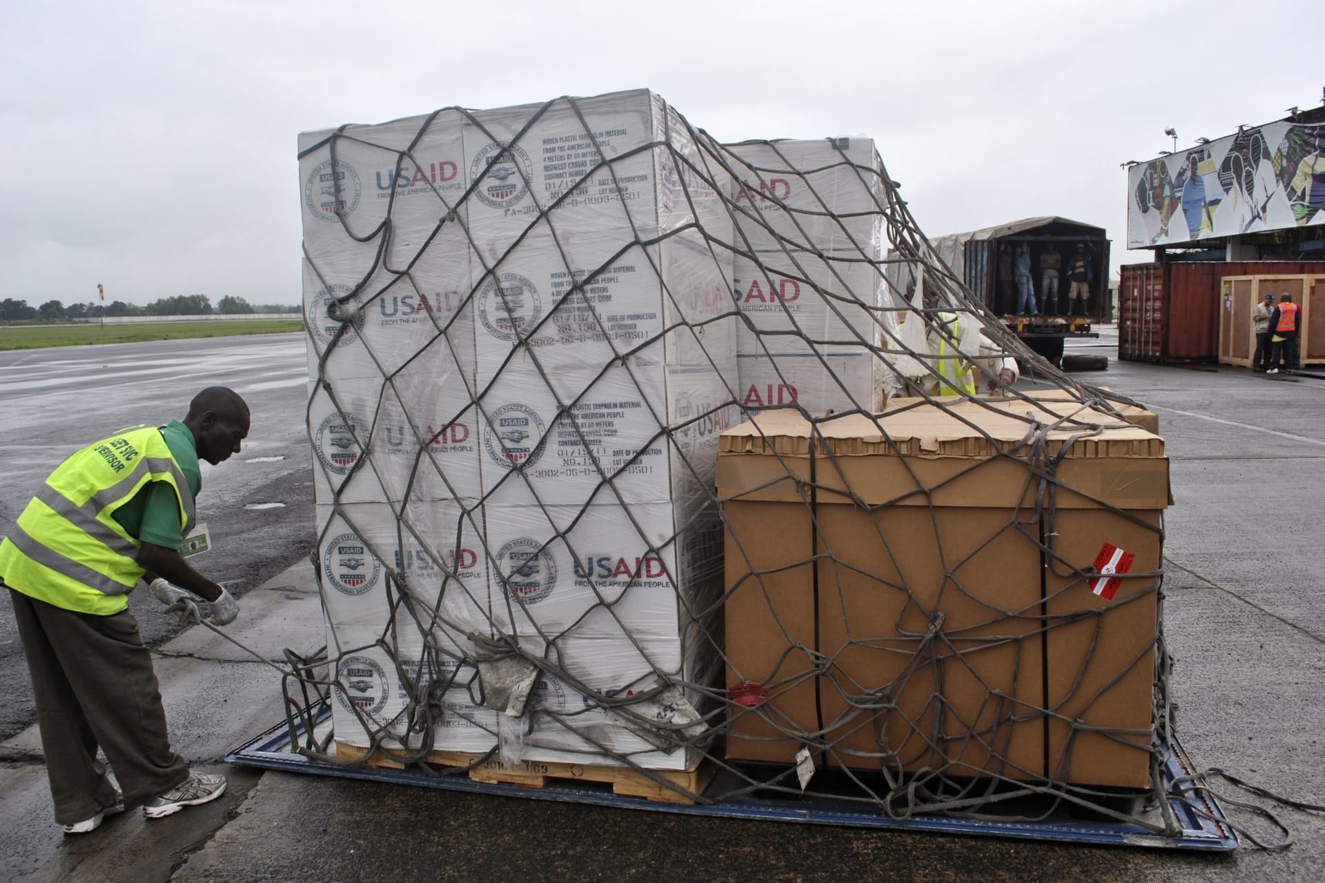 <p>Workers offload the first consignment of U.S. Agency for International Development (USAID) medical equipment towards the fight against Ebola, at the Roberts International Airport in Monrovia, August 24, 2014.</p>
