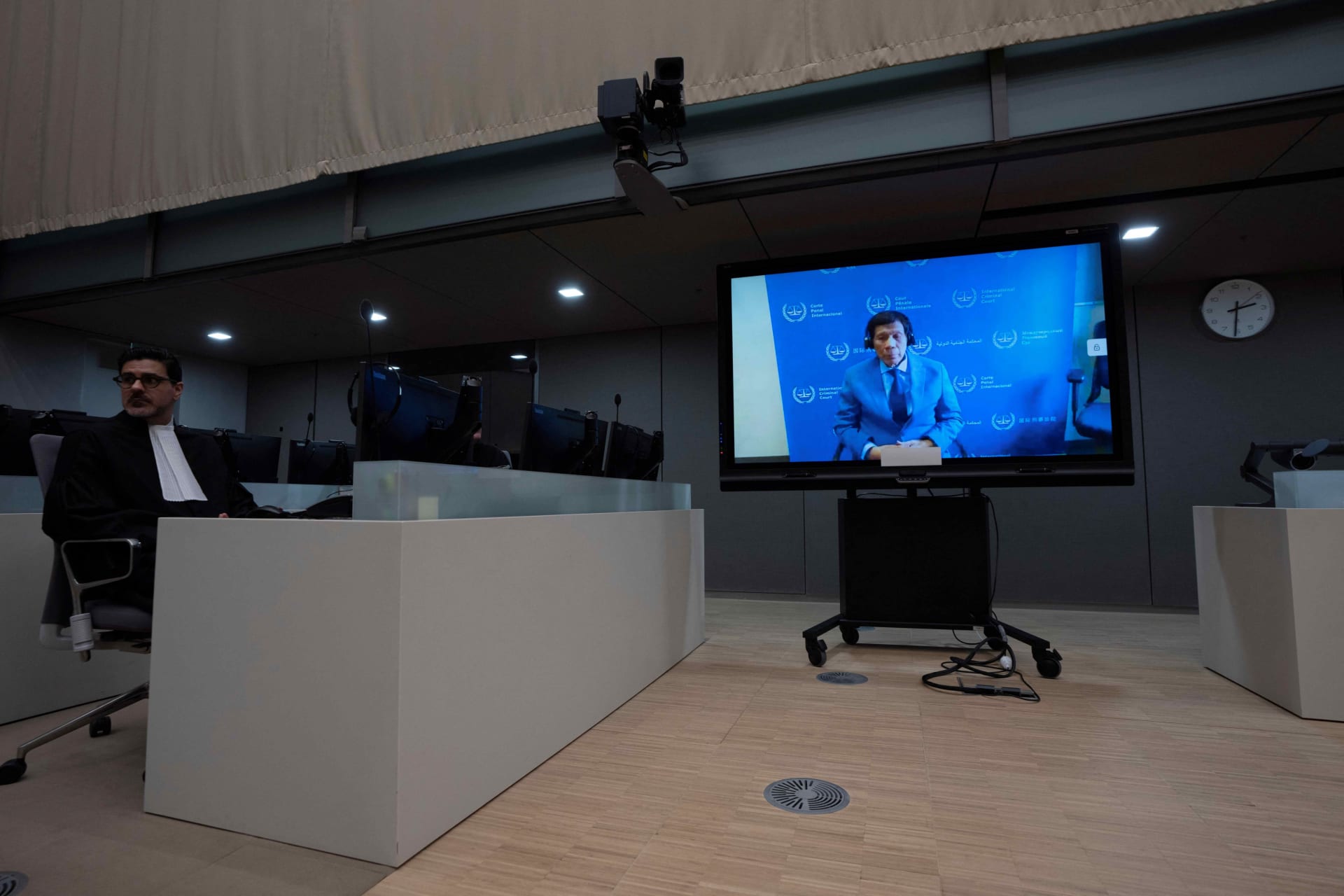 <p>Former Philippine President Rodrigo Duterte is seen on a screen in the courtroom of the International Criminal Court (ICC) in The Hague, Netherlands, on March 14, 2025.</p>
