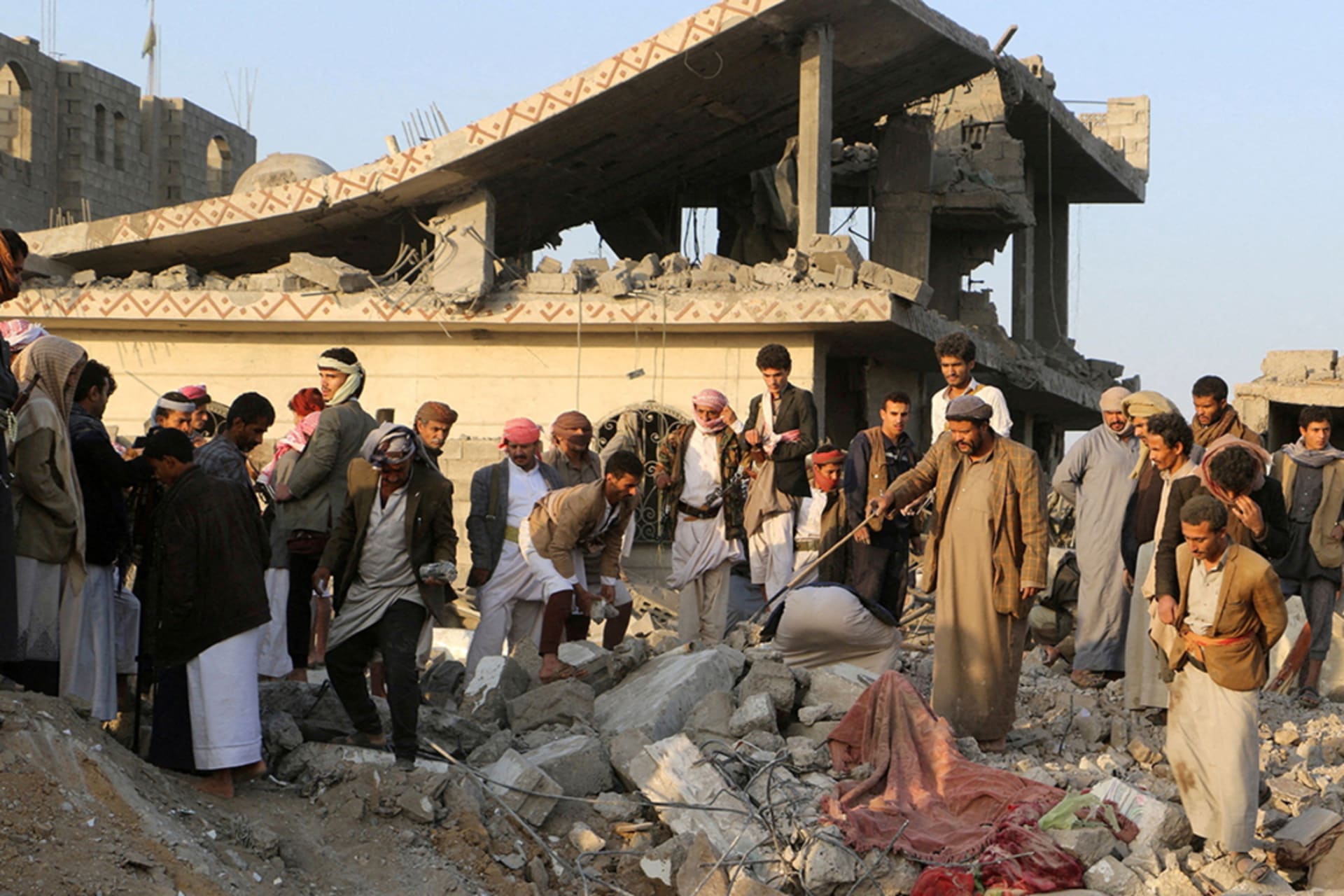 <p>People gather on the rubble of a house hit by a U.S. strike in Saada, Yemen March 16, 2025. </p>
