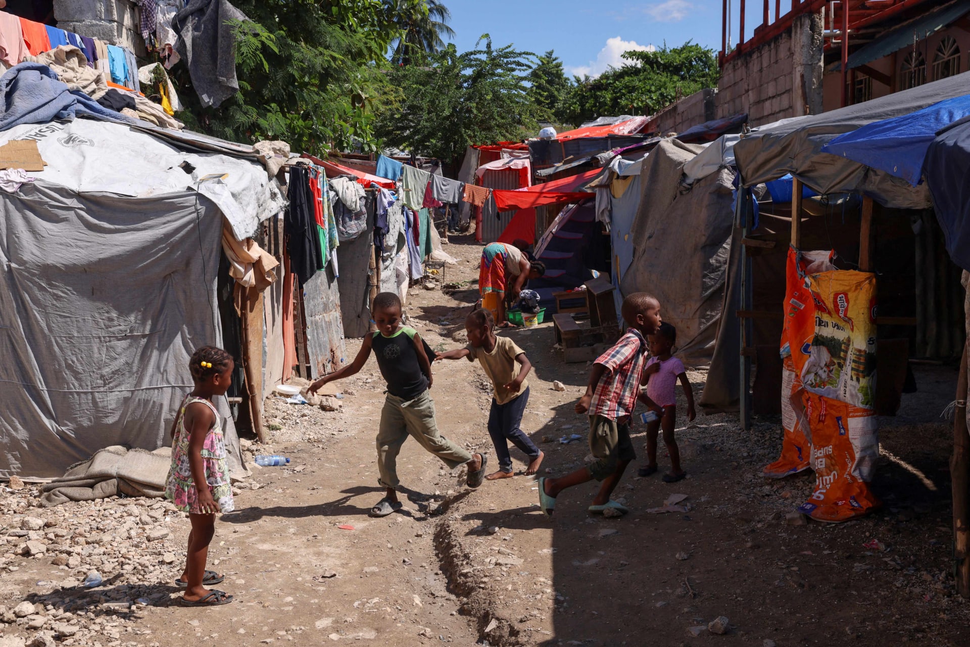 <p>Children play in a refugee camp set up at a school for people displaced by gang violence, in Port-au-Prince, Haiti October 31, 2024. </p>
